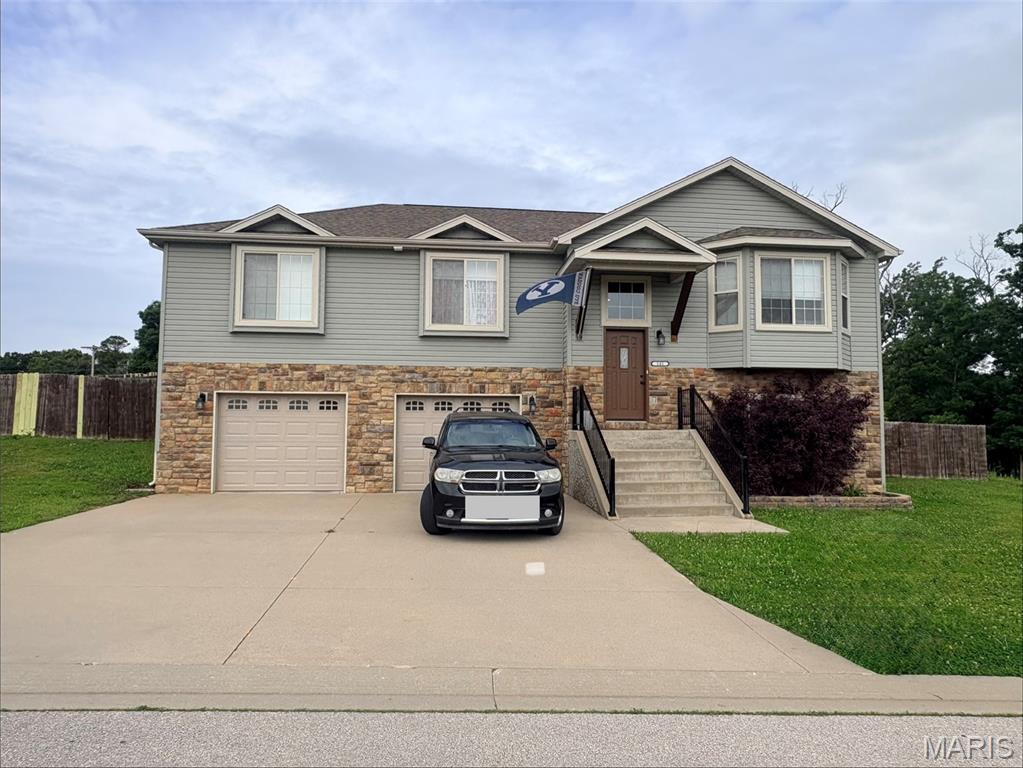 Welcome to 141 Creek View Dr, nestled in the Brush Creek subdivision. This Austen model home features three bedrooms on the upper level, two full bathrooms, living room, kitchen, dining and laundry room, along with access to an oversized deck, overlooking a fenced yard that backs to trees. Enjoy the updated flooring throughout too! Head downstairs where a family room, bedroom and bathroom await, along with access to an oversized two car garage, complete with 30 amp plug for your additional needs! The home is tenant occupied, with vacancy at the end of June, making this perfect for your Summer timeline, without sacrificing location or budget!  Located just one mile from I-44, this home makes access to the Interstate, Fort Leonard Wood and all the conveniences of town, a breeze! Tenant occupied currently into June 2026.