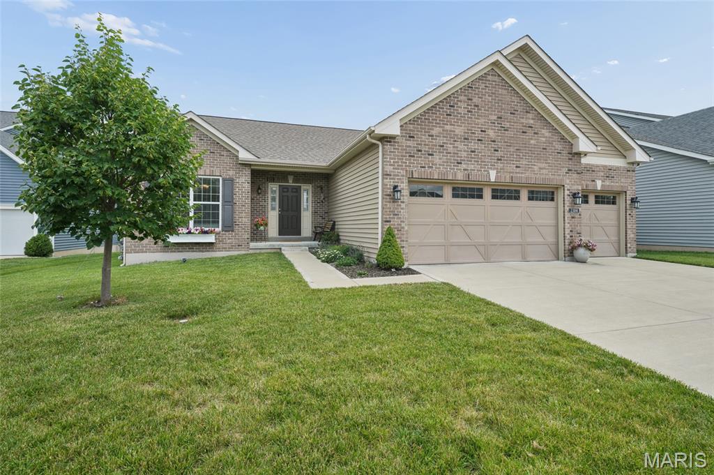 Beautiful ranch home offering an open and inviting floor plan with a desirable three-car garage and main-floor laundry. Luxury vinyl plank flooring flows throughout the main living areas, while the bedrooms feature comfortable carpeting. The spacious great room seamlessly combines the kitchen, breakfast area, and family room, creating the ideal space for everyday living and entertaining. The kitchen boasts a large center island with seating, ample cabinetry, and plenty of workspace. The oversized primary suite features a walk-in closet and a private bath complete with dual vanities, a separate shower, and a relaxing soaking tub. Two additional bedrooms and a full bath complete the main level. The semi-finished lower level offers an egress window, rough-in plumbing for a future bathroom, and abundant storage space, providing endless possibilities for additional living areas. Step outside to enjoy the patio overlooking the partially fenced backyard, ideal for outdoor gatherings, pets, or play. This well-maintained home combines comfort, functionality, and room to grow.