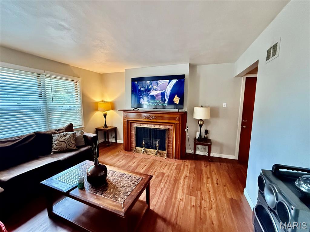 Truly exceptional home features a beautifully maintained interior. Beautiful LVP hardwood flooring throughout the 1st flr. The living room with a fireplace is a preview of how great this property is. A separate dining room w/modern touches, great for entertaining. Wake up refreshed in the generously proportioned main flr bedroom. A 2nd lg bedroom on main flr & 2 addtl lg bedrooms upstairs. A park-like backyard w/mature trees is a quiet haven where you can really relax. You'll soon discover why this neighborhood is much beloved by its community. A short drive to shopping, dining & a park. A great investment opportunity. This well-maintained property! 
Property being sold as-is. Currently under lease. Do Not disturb tenant. Home Is leased $1500 per month. showings on evenings and weekends only tenant must approve of time. Tenant wants to remain if possible. Lease must be honored through end of term end November 2026. Month to Month after. Copy of lease available after contract acceptance.