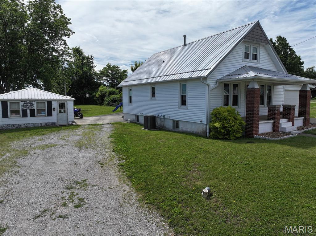 Charming home in a highly desirable Perryville location just off Highway 61! Situated on a little over a half-acre lot, this property offers a spacious backyard filled with mature shade trees, creating the perfect setting for relaxing, entertaining, or enjoying the outdoors.

The home features 2 bedrooms and 1 full bath on the main level, along with an additional upstairs space currently being used as a large open bedroom. An unfinished basement provides plenty of storage or potential for future finishing.

One of the standout features of this property is the former salon building located on-site, offering endless possibilities for a rental space, home business, studio, office, or guest quarters.

With its great location, large yard, and unique additional building, this property is full of opportunity for homeowners and investors alike!