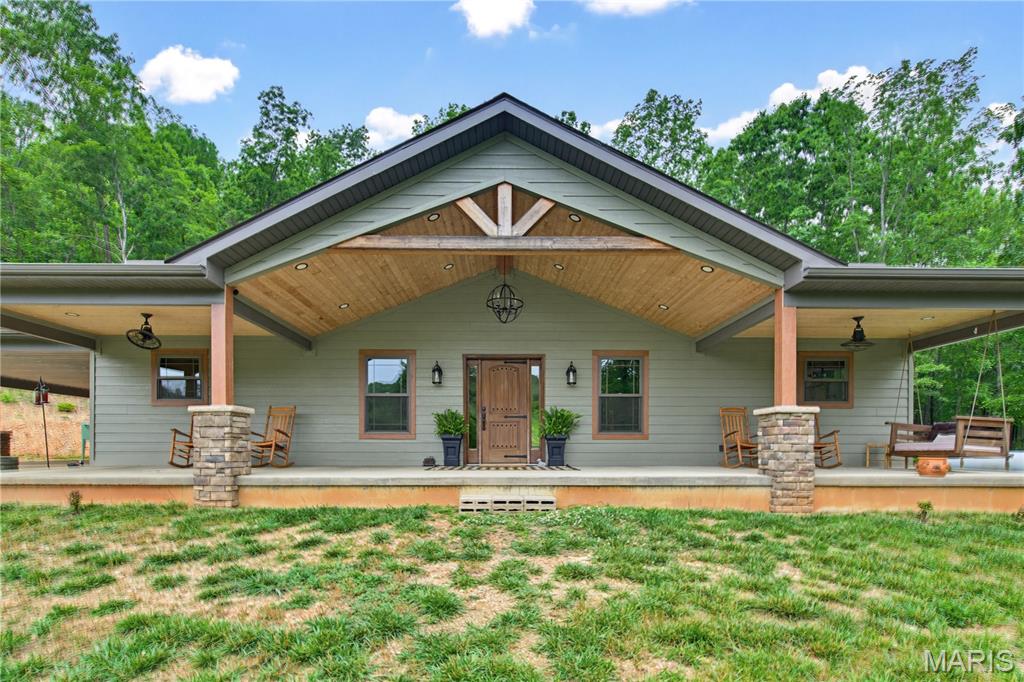 Amazing farm featuring a stunning custom home on 259.3 +/- acres in beautiful Southern Iron and Northern Wayne County! The home has LP Smart Siding. This gorgeous ranch-style home is perfectly elevated to capture breathtaking views across the rolling fields and countryside. Inside, you’ll find an open-concept living, dining, and kitchen area designed for comfort and entertaining. 
The chef’s kitchen is absolutely spectacular, featuring a massive quartz island, custom cabinetry, stainless steel appliances, gas cooktop, double wall ovens, microwave, refrigerator, and water softener. The spacious living room offers a beautiful stone gas fireplace, creating a warm and inviting atmosphere. The luxurious primary suite includes a relaxing soaking tub, separate walk-in shower, and quality Anderson windows throughout the home, and LP Smart Siding. Outdoor enthusiasts will fall in love with this property! Excellent hunting opportunities abound with abundant wildlife, mature woods, open pastureland, and diverse terrain. The farm also includes 2 spring-fed ponds, a small creek running through the property, and plenty of pasture for cattle, horses, or other livestock. A separate cabin on the property is perfect for hunting guests, family, or weekend retreats. 

Conveniently located near the beautiful 7 Lakes area and just minutes from Clearwater Lake, Clearwater Marina, Bluff View Marina, Sam A. Baker State Park, Elephant Rocks State Park, and Johnson’s Shut-Ins State Park. Approximately 1.5 hours from South County St. Louis, 1 hour from Poplar Bluff, and 1 hour from Farmington. This hidden gem truly must be seen to be appreciated!  

Wayne County Parcels  04-4.1-20-000-000-0003.000, 04-4.1-20-000-000-0004.000. Iron County Parcels 19-4.0-17-00-00-000-010-0000,
19-4.0-17-00-30-002-003-0000.