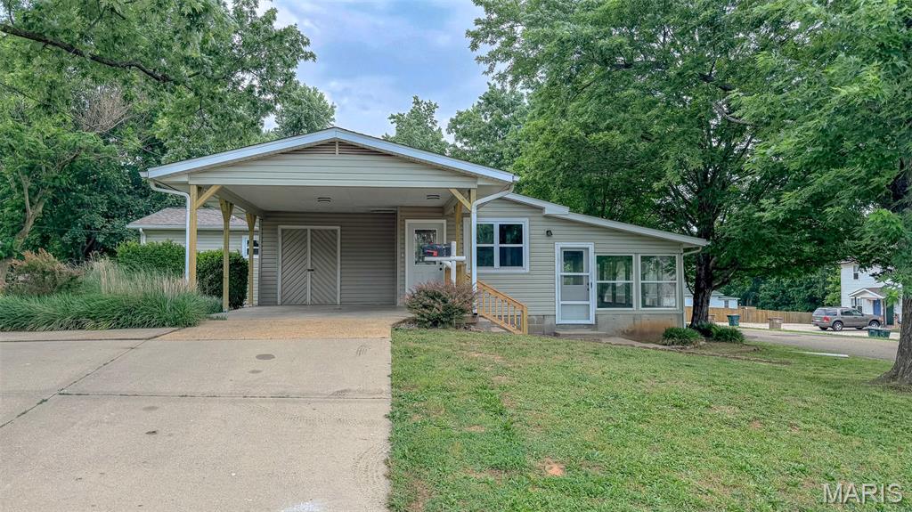Spacious and move-in ready! This beautifully updated 3 bed, 2 bath home sits on a corner lot and offers plenty of room both inside and out. Step into the large living room that opens seamlessly to the updated kitchen, creating the perfect space for entertaining. Recent updates include a new roof, HVAC, flooring throughout, fresh paint, updated kitchen, and remodeled bathrooms. The expansive master suite features a walk-in closet, while two additional sizable bedrooms and a full bath provide plenty of space for family. Enjoy relaxing in the sun room or step outside to the new deck overlooking the backyard. Additional features include a 30x24 detached garage, carport, and ample outdoor space. Move-in ready and waiting for its new owners!