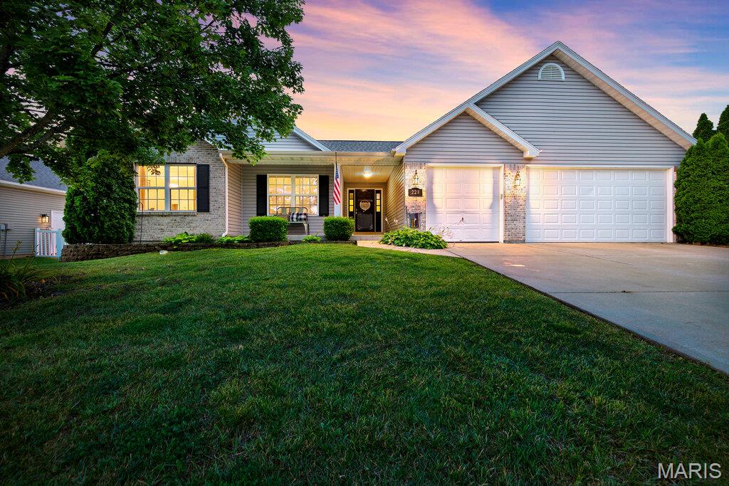 Welcome home to this stately three-bedroom, two-bath ranch offering an open floor plan, a three-car garage, and an unbeatable location in the heart of Wentzville! Just minutes from Wentzville Parkway, this home combines spacious living with everyday convenience. Step inside to find a large vaulted living room filled with natural light and designed for comfortable living and entertaining. The expansive kitchen is truly the heart of the home, featuring abundant counter space, a breakfast bar with high-top seating, formal dining space, and an additional breakfast area—perfect for gatherings large and small. The beautiful primary suite provides a private retreat with an attached en-suite bath complete with a separate shower and soaking tub, double-bowl vanity, and plenty of space to unwind. Main floor laundry adds convenience, while two additional generously sized bedrooms offer flexibility for family, guests, or a home office. Enjoy relaxing on the covered front porch overlooking the large level lot. The huge lower level offers endless possibilities and is ready for your finishing touches to create additional living space, a recreation room, home gym, or more. With its spacious layout, desirable features, and fantastic location, this home truly has everything you've been searching for and more!