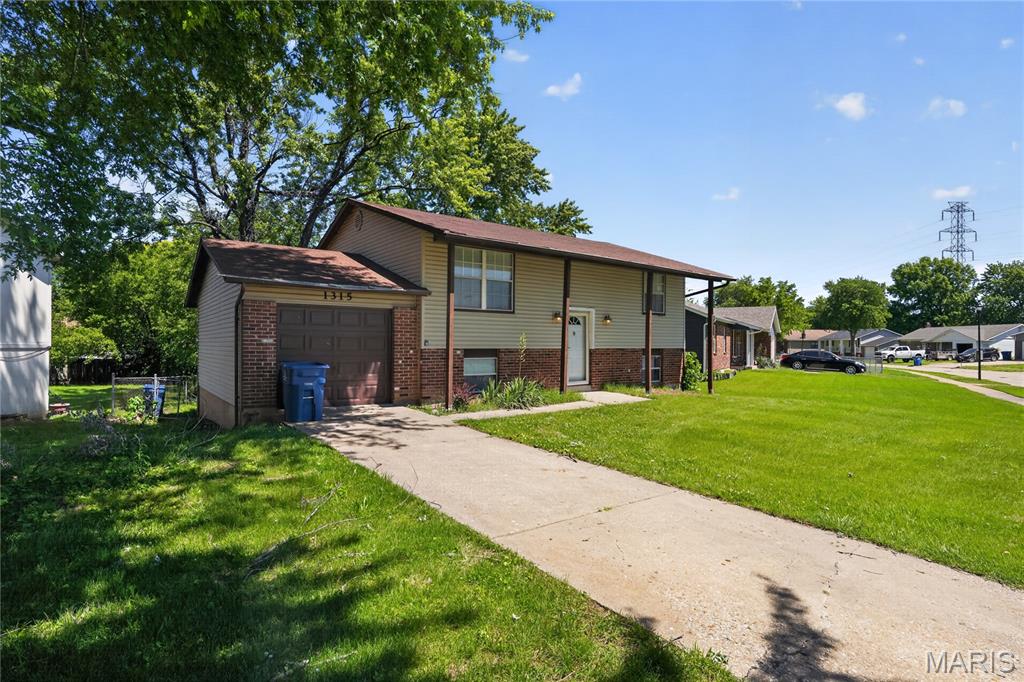 Well-maintained split-level home offering a spacious and versatile layout. The upper level features a living room, dining room, kitchen, 4 bedrooms, and 1.5 full bath. The lower level adds flexibility with a large family room, two additional rooms, a half bath, and a laundry area—ideal for extra living, office, or guest space.

Enjoy outdoor living with a fenced yard and deck, plus the convenience of a one-car garage. Roof replaced in 2018 for added peace of mind.