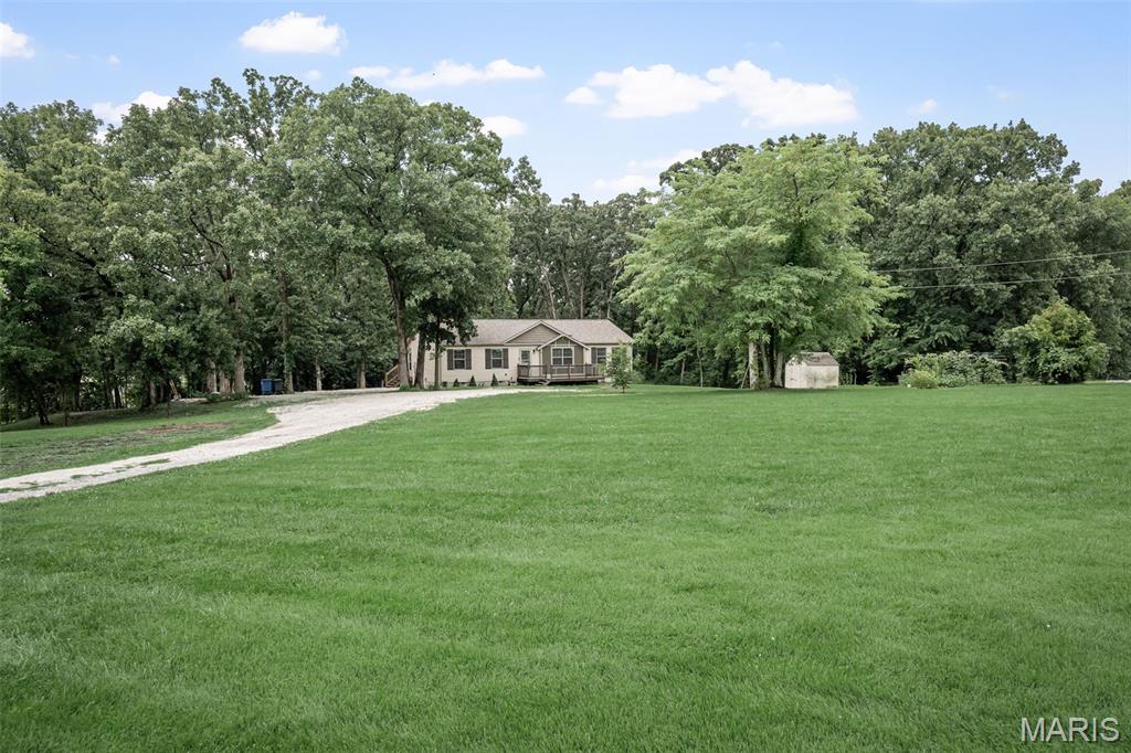 Beautiful setting on 3.41 cares- Spacious Smart Home w finished walkout bsmt! If you're looking for peaceful country living w modern conveniences, this stunning 3 bd, 3bth true modular home is a must-see! Nestled on 3.41 picturesque acres, this home offers the perfect blend of comfort, space and nature.
Inside, you'll love the popular split-bdrm flr plan, luxury vinyl & laminate flooring and an open welcoming layout. The kitchen comes complete w all appliances and the island, making it move-in ready.
The fully finished bsmt provides endless possibilities, featuring two sleeping rooms, craft, or game rooms, a full bathroom, and a spacious family room w abundant lighting & plenty of electrical outlets.  French doors lead directly to a relaxing patio, perfect for entertaining or enjoying the peaceful surroundings. 
Step outside from the dining room to the oversized deck and take in the beautiful views of the backyard as it meanders into the woods. Enjoy your own garden w fresh vegetables, along w colorful flowers that will bloom year after year. There is an 8'x8' storage shed that offers convenient space for lawn equipment and outdoor tools.
This home is equipped as a smart home, featuring Alexa integration, Blink security cameras, an Alexa-compatible thermostat, & Kwikset smart locks w Smartkey rekey technology, giving you comfort, convenience, & peace of mind.
With beautiful scenery, flexible living space,& modern smart-home features, this property truly has it all. Schedule your showing today and come experience everything this exceptional home has to offer!