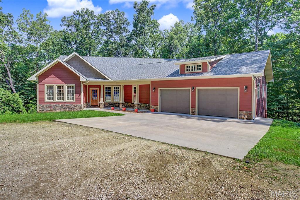 SERIOUS INQUIRIES ONLY BY APPOINTMENT
PRIVATE DRIVE ENTRANCE TO HOME - NO DRIVE BY'S PLEASE

This private estate home is located less than a mile outside of Cape Girardeau City limits.  Set on a 17+/- acre fully timbered land tract, this country-feel living home features an end-of-the-road privacy with a stocked pond and a live water creek.  

As you drive into this property, you immediately realize that you’re entering a special place.  The road in runs along a ridgetop through a mature clean wooded canopy and delivers you to the custom homesite overlooking the pond below providing rural privacy, but the benefits of urban amenities.  

Tucked away on this secluded property is an impressive three-bedroom, three-bath residence boasting approximately 3,952 square feet of living space.  The home features Cambria quartz countertops and custom, high-quality Beussink cabinetry in solid pecan wood in the kitchen, bathrooms, and laundry room, along with solid wood doors and trim throughout.  This traditional home offers an open concept with numerous windows and natural lighting surrounded by beautiful views of the tree canopy.  Other features include a huge walk-through pantry with room for a second refrigerator, the convenience of main-level laundry, a double-sided fireplace in the living room, a formal dining room, and a two-car garage.  There is a fully finished walk-out basement, providing ample room for entertainment and recreation, as well as additional living quarters for larger families, extended family, or visiting guests. 

Designed for both comfort and style, the house also provides an enjoyable outdoor screened living space with a covered deck, perfect for relaxing evenings or morning coffee while overlooking the picturesque landscape, watching the wildlife activity, and a great view of the pond in the valley below.  Every detail in this home is crafted to blend modern luxury and technology amenities with the tranquility of timbered country living, making this estate a truly exceptional find.

Back outdoors, there’s a level building area with electric accessible for a Buyer to construct a shed or shop area of their choice.

Loaded hardwood timber, the landscape is clean and clear of underbrush.  There is a fully stocked pond containing bass, bluegill, crappie, and catfish.  Because it is set in a deep valley, its normal pool is at 16-17ft depth, but tops out at 22ft when full.  Below that is the live water Juden Creek running through the property providing that fisherman the ability to seine his own minnows for bait.  There’s nothing better than fishing with your own supply of live bait!  There are also prime locations for a hunter to place tree stands on this unrestricted property.  Imagine harvesting a whitetail just steps from your home with your bow out of your own tree stand.

This unique property in a secluded setting is a very rare unique find.  It’s move-in ready and offers plenty of outdoor space for recreation.  Showings will be provided to only well-qualified Buyers.