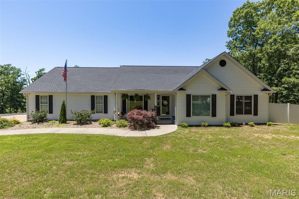 Over 4,200 finished square feet of living space on 3+ acres m/l—just minutes from town! This impressive 4-bedroom, 3.5-bath ranch offers the perfect combination of space, privacy, and convenience. With over 2,400 square feet on the main level and at least 1800 additional finished square feet in the walkout basement, there's room for everyone to live, work, and entertain comfortably.
The open-concept floor plan was designed with entertaining in mind, featuring spacious living areas and an updated kitchen with newer appliances and updated countertops. The primary suite includes a beautifully remodeled bathroom completed in 2021, while new flooring installed throughout the main level in 2022 adds a fresh, modern feel.
The finished walkout basement provides an abundance of additional living space and includes a basement garage for added convenience. Step outside and discover your own backyard oasis featuring an pool surrounded by approximately 1,200 square feet of stamped concrete, creating the ultimate setting for summer gatherings. A covered deck overlooks the property, offering the perfect place to relax and enjoy the peaceful surroundings.
Major updates provide peace of mind, including brand-new windows throughout the home in 2024 and a complete exterior transformation in 2026 with a new roof and all-new siding. The deck was freshly re-stained in 2026, making this home truly move-in ready.
Additional amenities include zoned heating with gas heat on the main level and electric heat in the lower level, RV hookup with a dedicated RV parking pad, generator/hot tub hookup, and a recently resealed blacktop driveway. If you've been searching for acreage, extensive living space, and a location that offers country living less than a mile from town, this property deserves a closer look.