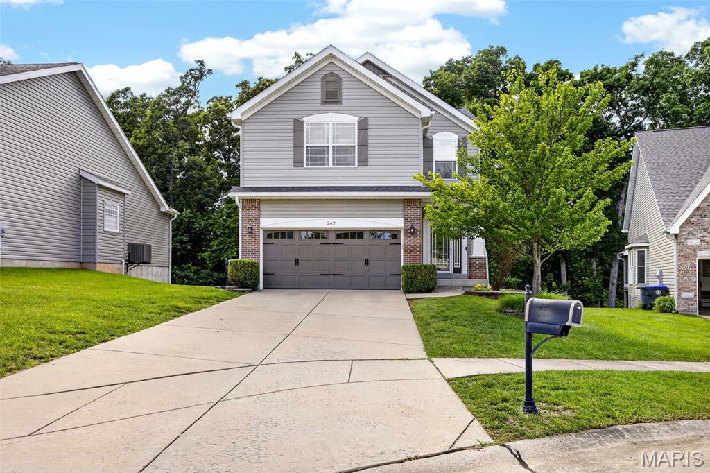 Welcome to 262 Sunset Villa, where extensive updates and thoughtful design create a truly move-in ready home. From the moment you arrive, you'll appreciate the impressive curb appeal featuring a new architectural roof, siding, shutters, garage door, gutters, and updated exterior lighting.
Inside, natural light fills the home, showcasing beautiful engineered white oak hardwood flooring throughout the main living areas and fresh paint throughout. The completely renovated kitchen serves as the centerpiece of the home, featuring stunning Taj Mahal quartzite countertops, all-new appliances, updated cabinetry, and stylish finishes that blend elegance with everyday functionality.
The open floor plan offers comfortable living and entertaining spaces, while the spacious owner's suite provides a relaxing retreat with updated lighting, vanity, and flooring in the primary bath. Additional updates include new flooring in the upstairs guest bathroom and an updated main-floor half bath featuring a new vanity and flooring. The convenience of upper-level laundry makes daily living even easier.
The finished lower level adds valuable living space and is ideal for entertaining, featuring a wet bar, large recreation area, and half bath.
Step outside through the new sliding glass door to enjoy the deck overlooking a large, tree-lined backyard that offers privacy, beautiful views, and plenty of room to relax or entertain.
With extensive updates throughout—including the roof, siding, gutters, garage door, flooring, paint, kitchen, appliances, lighting, bathrooms, and more—this exceptional villa offers the perfect combination of modern style, comfort, and low-maintenance living in a convenient O'Fallon location close to shopping, dining, parks, and major commuter routes.