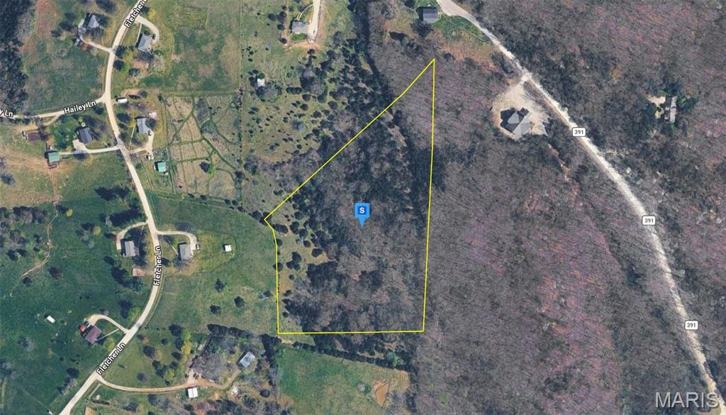 Discover this 8.6-acre residential lot in the Holts Summit area of Callaway County. Featuring partially wooded terrain that gently slopes toward the center of the property, the lot offers a peaceful natural setting with privacy and character. With no HOA restrictions, you'll have added flexibility for future development. Located in a quiet area just minutes from Holts Summit and Jefferson City, the property offers convenient access to shopping, dining, schools, and everyday amenities while being surrounded by the scenic beauty of central Missouri. This property presents an excellent opportunity to build your future home in a tranquil setting.