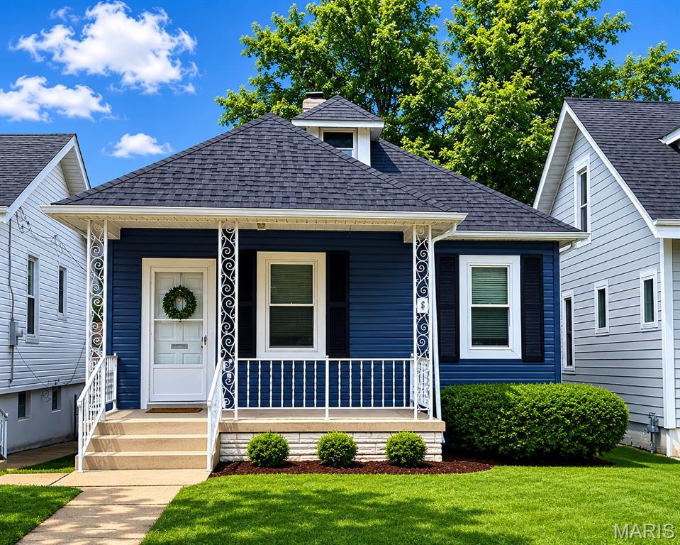 Absolutely darling bungalow nestled in the sought-after South Hampton neighborhood (SOHA) on one of the area’s most desirable and quiet streets. Just minutes from your favorite coffee shops and eateries on the magnificent Macklind Mile, as well as the Buder Branch Public Library and well-loved retailers on Hampton, this home’s location is tough to beat. Arguably the cutest house on the block, with its Cape Cod curb appeal featuring a Wedgewood blue frame, crisp white trim, and a welcoming front porch. (A total exterior makeover in 2025 with new siding, roof, shutters, and gutters definitely turned this place into a show-stopper.)

And that is just the beginning. Inside, the charm continues with chic cottage detailing and a color palette. The white clapboard entry and cubbies to hang your coat create an open living space with luxury vinyl plank flooring. You’ll love the farmhouse board-and-batten accent wall with a rustic mantle and a trend-setting electric fireplace that offers the cozy ambiance of a traditional hearth with zero venting, smoke, or sweeping required, plus a large flat-screen for viewing pleasure. Enjoy a convenient and cheery main-floor bedroom and updated bath. The well-equipped kitchen with pretty wood countertops, custom cabinetry, sleek subway tile, cute shelving, and exposed original brickwork will certainly make you smile. A walk up the renovated staircase reveals a fantastic second bedroom with more exposed brick and a window seat, plus a bonus room that currently serves as another sleeping area but has also served as a walk-in closet and extra storage in this gem’s previous life. Complete with a walk-out basement boasting a fun space for a home office or music studio, a relaxing wood deck off the kitchen with a seating/storage bench, an oversized 2-car parking pad out back, and an expansive fenced backyard just waiting for gatherings all summer long. Yes, it’s time to make this one home. *Seller to include 1-year Home Warranty!