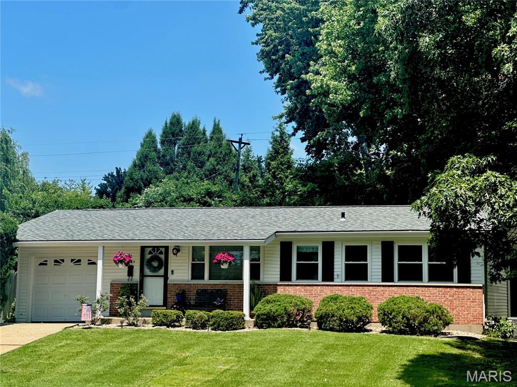 Welcome to this beautifully maintained, move-in-ready gem that perfectly balances cozy interior comfort with an outdoor paradise! Inside, beautiful wood floors flow through a natural light & bright layout featuring  3 bedrooms, the third currently used as a dining room, and tasteful updated bathrooms. You'll enjoy the well appointed kitchen, warm wood cabinetry with crown molding and a bright garden window--perfect for nurturing fresh plants or fresh herbs, and a pleasant view of a beautiful backyard. The living space extends into the partially finished lower level, where a ventless gas fireplace serves as the perfect centerpiece for movie nights or winter relaxation.Step outside into your own private sanctuary. The magnificent private 6-foot fenced backyard is a landscaper's dream. Enjoy peaceful mornings on the great patio surrounded by colorful perennials and soothing sounds of visiting birds. Updates include vinyl siding & gutters, encl soffits/fascia, windows & storm doors, six panel white doors and trim, newer gas cooktop and dishwasher,  Roof (8yrs), A/C (3yrs) Complete with a 1 car garage and immaculate care throughout. Washer/Dryer/Refrigerator will stay (as-is)This property is a rare find. Occupancy Inspection has been completed and passed.