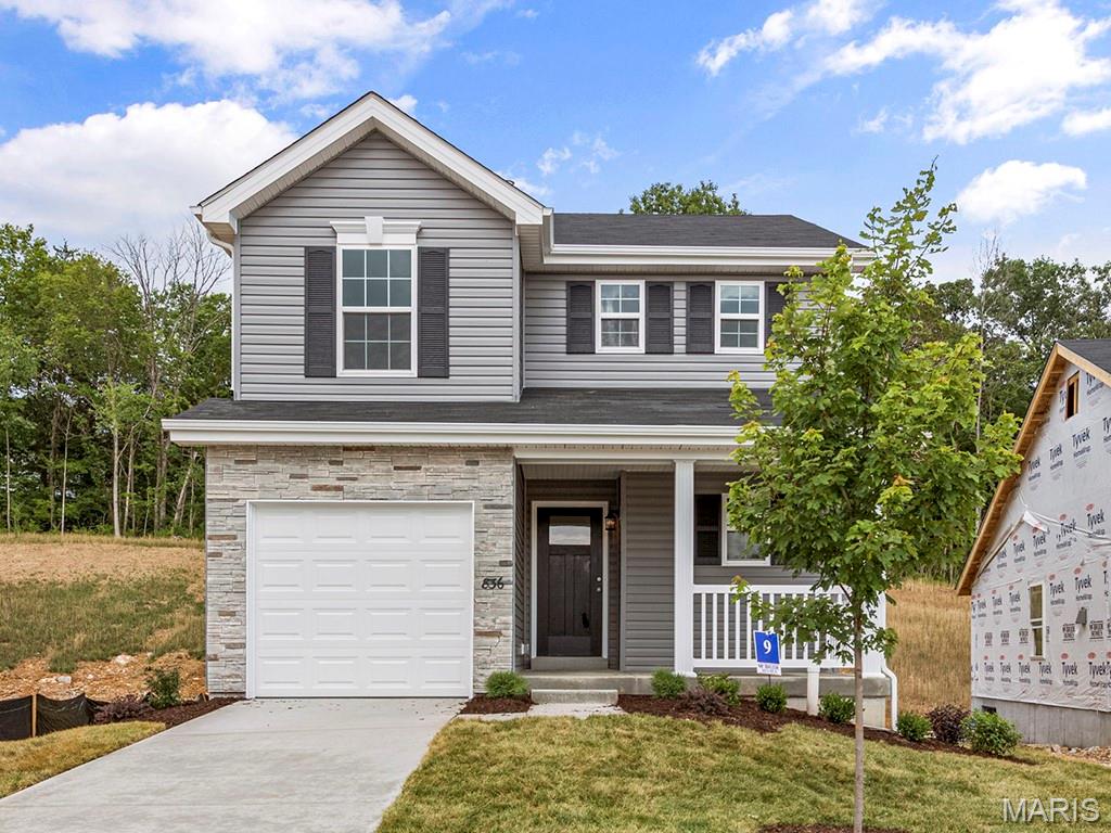ready this spring! Partial walkout homesite! Perfect for entertaining with an open floorplan, 6’ windows, wood laminate flooring, & a spacious family room with a ceiling fan. The kitchen features dark 42” cabinets, breakfast bar, quartz countertops, & stainless-steel GE appliances. Dining area offers sliding glass doors leading to the backyard. Upstairs the primary suite has a ceiling fan, walk-in closet & luxury primary bathroom. 2 additional bedrooms, and shared full bath w/linen closet add convenience. One car garage w/coach lights, upgraded fixtures, ceiling fan prewires, main floor powder room, white 2-panel interior doors, & more! The LL includes ¾ bath roughin for future finish. Located in House Springs, this community features 263 homesites off Bear Creek Road, just east of Gravois Road & Carol Park Road. Enjoy peace of mind with McBride Homes’ 10-year builders warranty & incredible customer service! Similar photos shown.