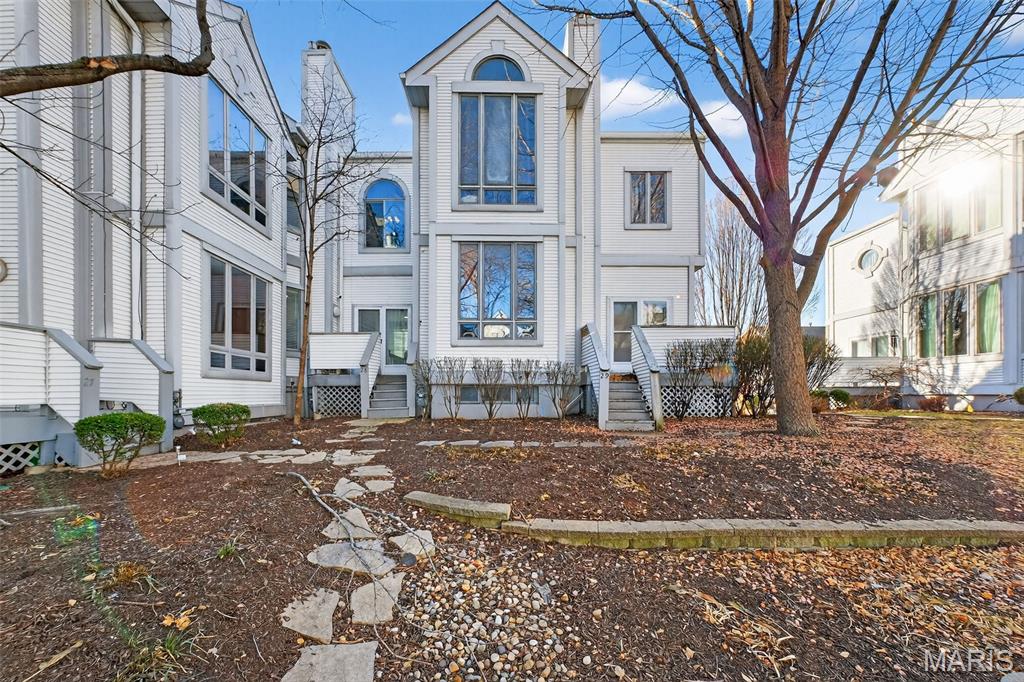 This downtown townhome is waiting for you to call home, or add to your long-term investment portfolio. You are just minutes away from restaurants, major businesses,  the St. Louis Arch national park, the Horseshoe casino, major sporting events and the nightlife on Washington Avenue. This end-unit townhome features luxury vinyl plank flooring throughout main and upper levels, plus highly coveted private 2 car garage and laundry area. New garage door opener. Soaring 10 foot ceilings on both levels. Living room flows into the kitchen which features granite counter tops, stainless steel appliances, breakfast bar, pantry, breakfast room and plenty of cabinetry. French door access to rear deck is just off the kitchen. The deck overlooks a beautiful courtyard area. Half bath on the main level is a huge convivence for everyone. A/C unit is 2 years young Upper level features 2 large bedrooms with plenty of closet space. Hall bath has tasteful subway tile surrounded tub/shower combo and a white "penny" style ceramic tile floor. It's beautiful and waiting for you to call home.