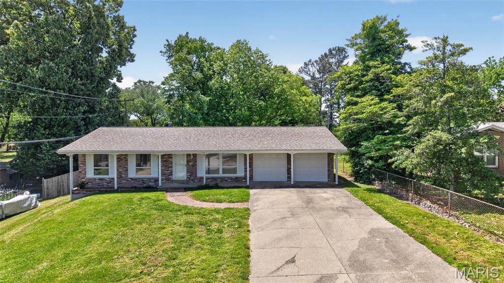 Well-maintained brick and vinyl ranch offering approximately 1250 sq ft in an established neighborhood.  This 3-bedroom, 2-bath home features a 2-car garage and a comfortable floor plan with many updates completed in recent years.  Situated on a large shaded lot with mature trees, providing plenty of outdoor space to enjoy.  Two additional outbuildings offer great storage for lawn equipment, gardening tools, hobbies, or other miscellaneous belongings.  This home is a great opportunity for anyone looking for a move-in-ready home with charm, space, and convenience.
Offers will be accepted until 1:00 pm on Tuesday, May 19, 2026, with response time by 9:00 am on Wednesday, May 20, 2026.