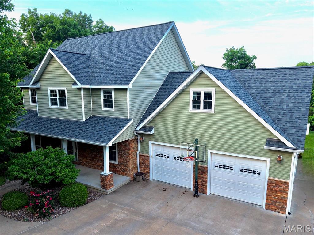 Comfort and convenience in this attractive single-family residence built in 2012 offers a great property for modern living. The heart of this home is its well-appointed kitchen with ample cabinets, granite counter-tops, eating bar, and pantry.  Enjoy the living room with gas log fireplace, separate dining room and office  all complete the main level. 4 bedrooms upstairs with spacious primary bedroom (with remote drop down TV), large bathroom with shower and jetted tub as well as nice walk-in closet.  Three additional bedrooms complete this level in addition to a second bathroom and laundry room. Entering the finished basement offers two family room areas that suggests possibilities of a rec area or game room, space set aside for a bar, and a 5th bedroom with full bathroom on this level.  Beyond the interior, the property extends its living space outdoors with a composite deck overlooking the private backyard ideal for entertaining or quiet relaxation. This property presents an exceptional opportunity to embrace a refined living experience.