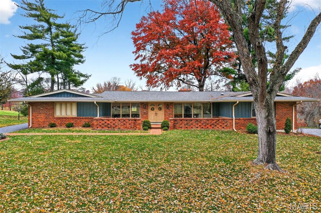 Welcome to this Beautiful 3 bedroom 2 bath ranch home in Ladue Trails. As you approach the front door you will cross a large front yard featuring a courtyard with brick walls. This delightful property backs to acres of common ground with wonderful sweeping views and beautiful garden area. The center hall plans features a formal dining room, living room that opens to a family room with parquet wood floors. Other features are a built in wet bar, brick fireplace and cathedral ceiling. Glass doors opens to large deck with screened in gazebo. Eat-in kitchen with pennisula and granite counters and bay window. Full basement, paritally finished with tile floor and an art studio. Two car rear entry garage.  You'll love this home!