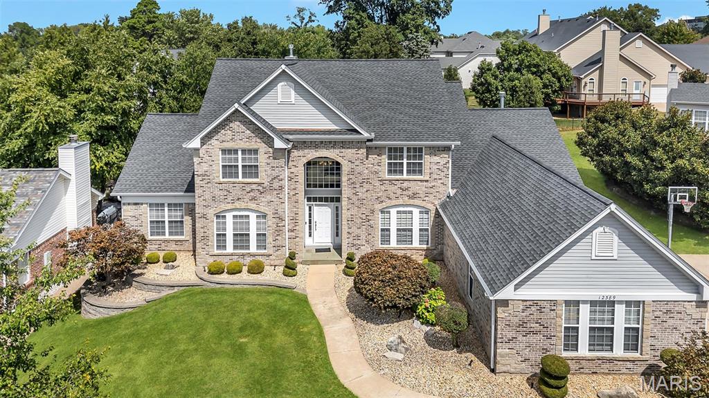 Spectacular 1.5 Story located in Questover Place one of Creve Coeur's most desirable premier neighborhoods with its beautiful tree-lined streets full of friends enjoying all the amenities the area offers. Walkable neighborhood just minutes from numerous restaurants, shops, cafes & more! Exceptional exterior with a 3-car side-entry garage, attractive landscaping and prominent front entrance. Boasting 5 bedrooms & 5 baths, this home underwent a complete remodel in 2018 with a distinctive contemporary style! Grand 2-story entry with impressive staircase gives way to a stunning interior boasting an expansive open-concept design with light-filled rooms, engineered wood flooring, soaring ceilings & large windows. French doors from the foyer open to the office with fabulous built-ins. Dining room and an exceptional great room with serving bar, built-in wine fridge & rack. Extraordinary kitchen with Centorbi custom cabinetry, walk-in pantry, gorgeous Quartz, Thermador appliances, massive island with seating & breakfast room. Vaulted hearth room features heated flooring. Spacious laundry with custom built-ins. Lovely powder room, too. Fabulous Primary En-Suite! Luxury bath with dual vanities, heated flooring, zero-entry contemporary shower & a beautiful Victoria+Albert Barcelona tub! Three bedrooms on the 2nd floor each with a private bath. Great additional living space in the lower level with 5th bedroom, 5th full bath, spacious media/family room, kitchen, gym, craft room & storage.