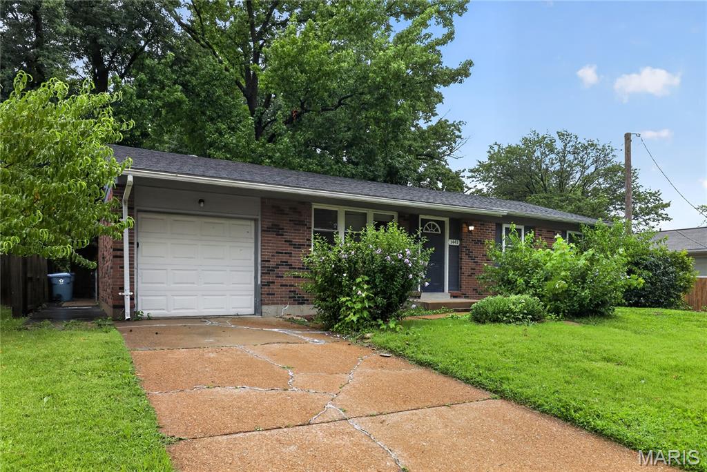 Discover classic charm in this well-maintained ranch home located in the heart of Hazelwood. This inviting residence features beautiful hardwood flooring throughout the main level, complemented by a spacious, sunlit living room perfect for relaxing or entertaining. The functional kitchen offers an efficient layout with easy access to the backyard. Three comfortable bedrooms provide versatile space for family, guests, or a home office. Situated on a level lot, this home also includes a full basement for extra storage and a convenient one-car attached garage. Ideally positioned near major roads and local amenities.