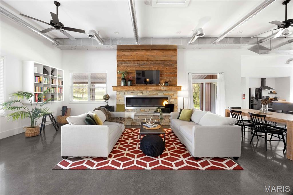 This little Augusta house is pure wine country magic — with serious style. Set on nearly one and a half private acres in the heart of charming Augusta, Missouri, 162 Jackson Street is a rare, turn-key completely furnished retreat that blends small-town character, natural surroundings, and a polished, high-style interior that feels more like a boutique getaway than a typical weekend house. Currently operating as a highly rated, income-producing short-term rental, the home is perfectly suited for winery weekends, weddings, Katy Trail riders, girls’ trips, family getaways, and easy escapes from St. Louis. Inside, the home is absolutely unforgettable. The huge open floor plan features 14’ ceilings, industrial details, heated concrete floors, a dramatic fireplace, custom finishes, a 50-square-foot butcher block island, barn door accents, cozy bedrooms, and a spa-like walk-in shower. The result is a space that feels stylish, comfortable, memorable, and perfectly designed for gathering. The location offers the best of Augusta wine country living. Shops, restaurants, wineries, trails, and event venues are walkable or just a quick drive away, while the home itself offers a peaceful private setting with beautiful views of nature. Take your pick of outdoor sitting areas for morning coffee, an afternoon glass of wine, or quiet evenings after a day exploring Augusta. With fiber-optic internet, generous parking, room for recreational vehicles, and space for future expansion, the property offers both charm and practicality. Keep it as an income-producing short-term rental, make it your personal weekend retreat, or settle in full-time and enjoy the charm of one of Missouri’s most beloved small towns.