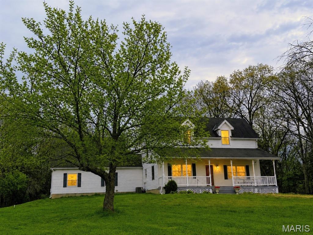 Tucked away at the end of the road, this 56 acre property offers a combination of privacy and usable land. Ideal for horses, cattle or simply enjoying its quiet beauty. The custom-built, move-in-ready home offers 4 bedrooms and 2 1/2 baths
and showcases quality craftsmanship throughout. Beautifully refinished hardwood floors, brand-new carpeting in all four bedrooms, and fresh paint throughout the home provide a clean, updated interior that's ready to enjoy. Solid oak doors and generously sized closets can be found throughout. The property features a barn with a spacious hayloft and chicken
coop. A separate mobile home, located out of sight from the main house, provides additional living space. If you've been searching for a private, beautiful piece of land within reach of St. Louis, this one is truly a rare find!