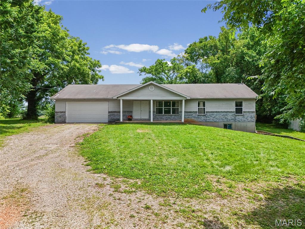 3 Bedroom 2 Bath Ranch home on almost 5 acres! The 1600 sq ft.  home is in need of updating, and has the following features- an open floor plan, main floor laundry, attached two car garage, the master bedroom has a walk-in closet, a walkout basement, a nice patio  in the private back yard, this home is ready for you to take on and make your own! Seller selling the home as-is.