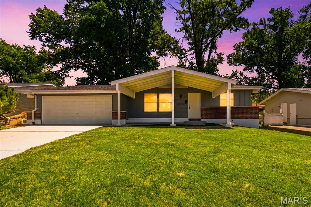 From the moment you arrive, the oversized covered front porch, freshly painted exterior, and crisp landscaping create an inviting first impression that reflects attention to detail found throughout this quiet neighborhood of long-term residents.

Step inside to appreciate the ease and durability of new luxury vinyl plank flooring that flows throughout the main level. The updated kitchen features classic white cabinetry, generous counter space, and a timeless design that makes everyday living and entertaining effortless. Three comfortable bedrooms and 1.5 baths complete the main floor, while the spacious two-car garage offers convenience and additional storage.

Downstairs, the unfinished lower level provides room to grow and endless possibilities. Whether you envision a recreation room, home office, workout space, or guest retreat, the second full bath is already in place—saving future renovation costs and adding immediate value. For added peace of mind, the foundation has been professionally evaluated and proactive repairs completed, allowing you to focus on settling in rather than tackling unexpected projects.

Why spend your weekends tackling expensive updates when this beautifully refreshed mid-century modern ranch is ready for you to move right in? An affordable, updated home where the major work has been done is ready for you. This is the opportunity you've been waiting for. Welcome home!