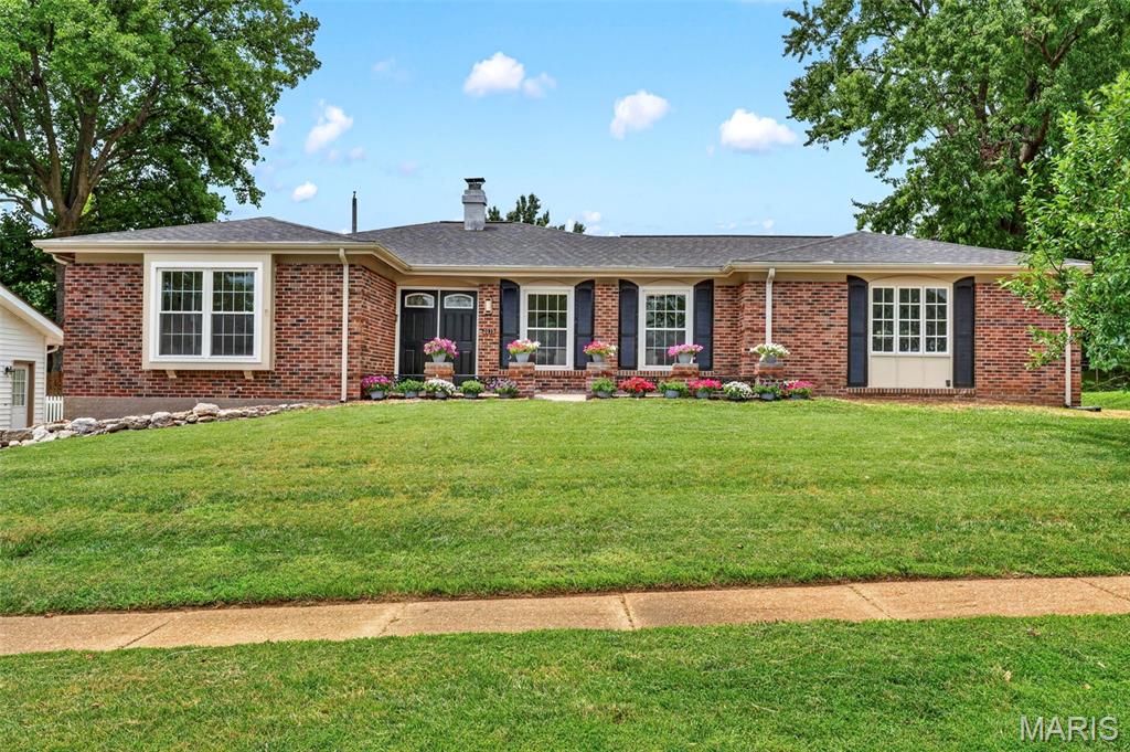 Beautifully renovated all-brick ranch offering 3 bedrooms, 3 full bathrooms, and thoughtful updates throughout. With curb appeal that makes you want to stop the car, this home is a must-see! A welcoming foyer opens to the main living area, where hardwood floors extend throughout much of the main level. The layout flows easily from the living room to the dining area and into the show-stopping kitchen. Highlights include stainless-steel appliances, two-tone soft-close cabinetry, a backsplash that adds a pop of color, and a convenient side-entry walkout. Just off the kitchen, the family room features a cozy fireplace, skylight, and sliding glass door leading to the back patio. The primary suite offers plenty of natural light, dual closets, and a private en-suite bath. Two additional bedrooms and a beautifully updated second bathroom complete the main level. The finished lower level adds generous extra living space with a freshly carpeted recreation room, a third full bathroom, and a versatile bonus room. Outside, enjoy the patio and backyard, along with the charm of a fruit-bearing tree in the front yard. A two-car attached garage completes the home. Offering updated finishes, flexible living space, and a functional floor plan, this home is ready for its next chapter.