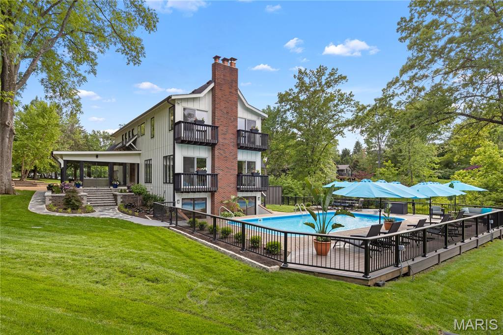 In an Idyllic location at the end of a private, gated cul-de-sac in the Village of Westwood, sits 12001 Robyn Park Drive. Set on a professionally landscaped one-acre lot, this 4 bedroom, 4 and a half Bath Home was built for entertaining with over 5000 finished square feet, multiple decks and patios, and a beautiful pool. The main floor features an open living and dining area with a woodburning fireplace, custom stone mantle, built-in cabinetry with wine cooler, and beautiful views of the grounds. The Kitchen has white cabinetry, granite countertops, a center island, breakfast bar, and NEW stainless-steel appliances. Just off the kitchen, the sunroom features ceramic tile floors and beautiful views. The large Family room has hardwood floors, wet bar, woodburning fireplace, and access to the pool and yard. A half bath completes the main floor. The second floor features a vaulted loft area with a deck overlooking the grounds, four bedrooms, and three full baths including 2 large bedroom suites with walk in closets. The primary suite has a large walk-in closet with organization, full bath with double sinks and separate tub and shower, and beautiful decks overlooking the pool. The lower level has 2 separate living areas that both have walk out access. One was used as a gym and office and the other functions as a pool house with a 4th full bath, fireplace, and walk out access to the pool and patio area. Additional storage and utility areas in the unfinished portion of the lower level. 2 car attached garage. NEW Roof and Gutters. NEW Decking. NEW Exterior and Interior Paint. The pool has a NEW Heater, Filter, Cover, Diving Board, Lighting, Paint, etc. 
Private/Gated Subdivision of only 4 homes. Parkway Central Schools. Excellent Private Schools in the area as well. Peaceful and Private but close to everything.