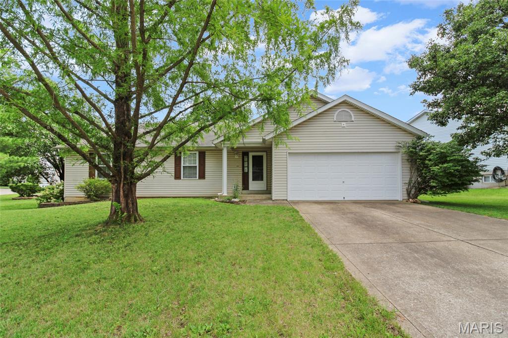 Welcome HOME to this great all main floor living ranch located by a cul-de-sac with a convenient, open layout and over 1,600sqft with room to grow! Covered front porch leads you to the inside with a wide hallway and closet to the large living room with vaulted ceilings, a fireplace and open layout to dining area & kitchen. You'll love the bay windows that lead you to your covered, backyard patio oasis. Spacious yard - see survey. In the kitchen, you’ll find a center island, plenty of cabinetry and a big pantry. Main floor laundry! Main floor laundry. Main level has two spacious bedrooms and a full bath. Additionally, the main floor primary suite gives you space to unwind with walk-in closet and has a separate tub & shower. Lower level can be fully finished for extra living space. Large space, blank canvas, ready for your ideas - how about a family room, additional sleeping room, home office or gym? Attached two car garage with additional space for storage. This is THE one. Very well maintained and move-in ready for you! Convenient location - close by all shopping, restaurants, all day necessities and near Hwy K & in between I-70, and the Page Extension for easy access. Located in the highly sought-after Fort Zumwalt West Schools district. You don't want to miss this one. Schedule your private showing TODAY