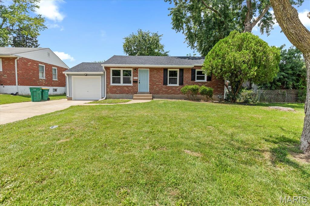 Welcome home to this beautifully updated 3-bedroom, 1-bath gem, perfectly situated on a quiet street in the desirable Belle Crest neighborhood. From the moment you arrive, you'll be impressed by the home's inviting curb appeal, featuring a concrete driveway and a brand-new front door painted a welcoming shade of blue. Freshly painted throughout, this move-in-ready home features brand-new luxury vinyl plank flooring across the entire main level, updated lighting throughout, and ceiling fans in every bedroom and the living room.  The abundant brand-new windows throughout the home fill every room with natural light.  The home offers many additional highlights, including a brand-new garage door, air conditioner, furnace, and roof! The heart of the home is the stunning, fully renovated kitchen, showcasing brand-new stainless steel appliances, including a dishwasher, microwave, disposal, range hood, and gas range with a built-in griddle—perfect for everyday cooking and entertaining. Stylish new shaker cabinetry, including 42-inch upper cabinets, is complemented by beautiful new countertops, creating a modern and functional space.  The renovated bathroom showcases stylish updates and a fresh, modern look. The partially finished lower level provides valuable additional living space, ideal for a family room, recreation area, home office, or workout room.  Step outside to enjoy the fully fenced backyard, offering plenty of space for pets, play, gardening, or outdoor entertaining. Additional highlights include a one-car attached garage, an extra-wide driveway with parking for two-4 vehicles, and a peaceful location in one of the area's most sought-after neighborhoods.  With extensive updates, stylish finishes, and an unbeatable location, this exceptional home is truly move-in ready. Don't miss your opportunity to make it yours!