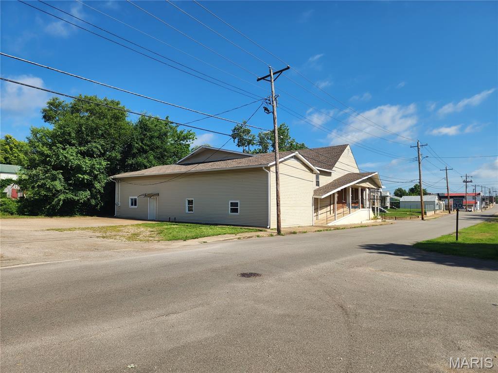 Bring your vision to life with this one-of-a-kind property offering incredible residential potential! With over 6,000 square feet above grade, nearly 1,000 square feet of basement storage, and situated on two surveyed parcels totaling 0.27 acres, this former church provides a rare opportunity to create a truly custom home or residential investment. 
Currently zoned C-2, the property offers flexibility for residential, religious, and/or commercial uses. The existing layout features a two-bedroom apartment (one non-conforming) complete with a full kitchen, living/dining room combo and full bathroom with laundry hook-ups, an approximately 2,500-square-foot sanctuary/great room, seven bonus rooms that could be reimagined as bedrooms, offices, hobby spaces, or recreation areas, a large gathering room and multiple restrooms—ideal for multi-generational living, guest quarters, or rental income.
The exterior includes four separate entrances, a parking lot with alley access, frontage on two city streets, and a rear driveway, providing convenient access and plenty of parking. The entire roof was replaced in 2022. The building is serviced by two electric meters — main level and two-story section. Property is being sold in it's current condition and church furnishings will be included with the sale.
Whether you're dreaming of an expansive custom residence, a live-work property, or a unique renovation project, this property offers the space and flexibility to make it your own. Cash or conventional financing only.
301 S. Division Street, Bonne Terre — $99,900. Schedule your private showing today!