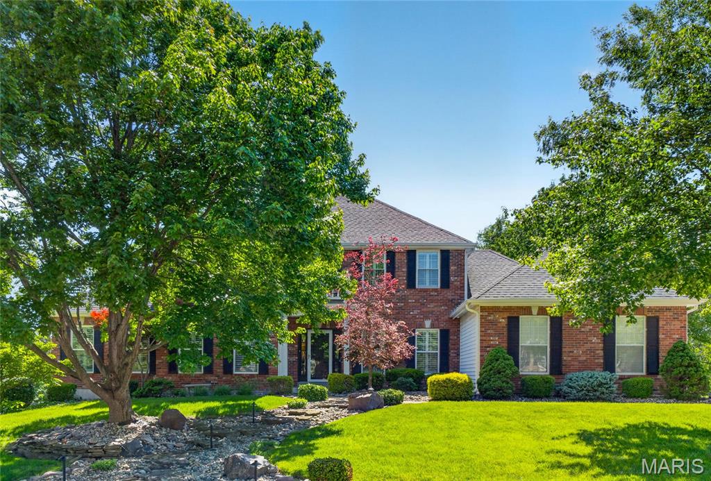 Turnkey 1.5 story Home on Hennsley Circle in Desirable Wrenwyck Place. Impeccably maintained 5 Bedroom house with over 4,400 total sq ft of living space. Full Brick Front and Custom landscaping with exterior lighting gives stately feel on arrival. Walk into Two story foyer with Elegant staircase featuring designer runner and one of a kind entry light fixture. Entry is flanked on one side by work from home office with added sound proofing, glass door, and custom wall paper.  Hardwood floors throughout main living areas including private dining room. Crown molding, wainscoting and custom archways are extra craftsmen touches. Renovated Dream Kitchen with granite countertops, stainless steel appliances, recessed lighting, And center island.  Oversize pantry with custom shelves as well. Breakfast room leads out to freshly stained deck overlooking large backyard with great tree cover. Family Room is large gathering spot with bay window, built in bookshelves, and gas fireplace. Main floor primary with wood floors and walk in closet. Primary bath w dual sinks and separate tub. Four bedrooms upstairs for your family! . Bed 2 with walk in closet near full hall bath. Beds 3 and 4 with shared full bath. Bed 5 is perfect nursery or another office. Huge Lower Level Rec Room has been freshly painted and has brand new carpet and is ideal for entertaining. Walk out lower level with bar and full bath,  plus custom shuffle board and TV area—all the fun you can have! Plus plantation shutters on main level and upstairs. Epoxy coating on flooring in 3 car side entry garage! Rear patio area and sprinkler system as well. Sought after Francis Howell schools! 
True craftsmanship and care in this ultra rare 1.5 story home in Wrenwyck!