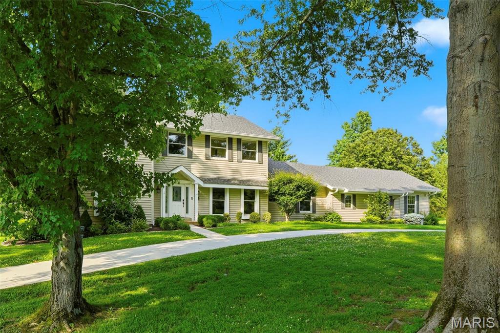 Are you looking for a home that offers tons of space, unique features, a level yard in a highly sought after neighborhood? This great home checks those boxes and then some with 6 bedrooms, 5 bathrooms, fresh paint throughout, brand-new carpet, new roof, a level lot, and a 3-car garage equipped with an EV charging station!  The main level provides generous living areas filled with natural light, a gas fireplace, a 5th bedroom with ensuite bath and main floor laundry. Upstairs is a large primary bedroom, a walk in closet and secondary closet as well as an updated ensuite bath with soaking tub, separate shower, skylight and heated floor. Three other very spacious bedrooms and a hall bath round out the upper level. The finished lower level is a standout feature, complete with a custom penny bar, wine room, secret room hidden behind a bookcase, 6th bedroom, and full bathroom—making it the perfect spot for entertaining, hosting guests, or simply enjoying a little extra space to unwind.  Outside, you'll love the deck overlooking the level .88-acre lot, providing plenty of room to play, relax, or create your dream outdoor living space. Generous living spaces, thoughtful updates, and one-of-a-kind features throughout make it the perfect blend of comfort, character, and functionality. Country Place subdivision offers 3 ponds and abundant common ground and is in Rockwood School District.
