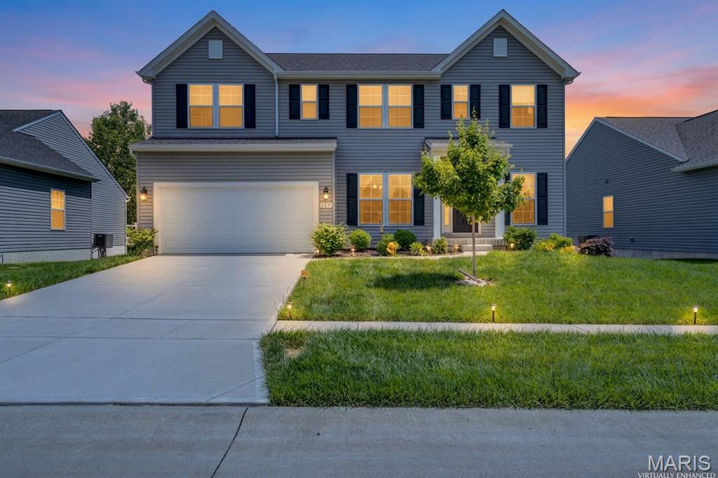 From the moment you step inside, your new home feels bright, calm and effortlessly inviting. One of the things you’ll love most is starting your mornings watching the sunrise overlooking the peaceful wooded backdrop behind the home. Built in 2022 by Rowles Homes, this 4 bedroom, 3.5 bath home offers over 2,600 sq ft with an open layout and upgrades throughout. The kitchen is truly the center of the home featuring 42” cabinetry, oversized island, gas cooktop, double ovens, pantry and stainless steel appliances all flowing directly into the living room with gas fireplace and backyard views. Just off the kitchen, the slider opens directly to the composite deck creating an easy indoor-outdoor setup perfect for entertaining, grilling out or relaxing outside with friends and family. The main floor also includes a separate dining room plus den/office giving the home multiple living spaces that feel both open and connected. Upstairs, the oversized loft creates the perfect second family room, movie room, playroom or office space while the vaulted primary suite feels spacious and private with walk-in closet and double sink vanity. Secondary bedrooms are generously sized with Jack & Jill bath access. Outside, sellers have already completed major upgrades including the composite deck added in 2024 and concrete patio installed in 2023. The walkout basement with rare 9-foot pour offers incredible future possibilities whether you envision a home gym, additional living space, bar area or guest suite. With the wooded views, upgraded outdoor spaces and open layout, this home is easy to fall in love with!