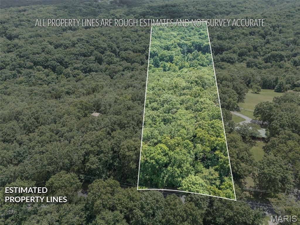 Build your custom home on this wooded 5-acre lot in the R-7 school district!
Your plan, your builder. Electric, internet, and phone are available at the road. The ground is flat, then drops off toward a small creek that runs through the midway point of the property. There's also room to build a large outbuilding.
This is a nice, small neighborhood of homes. You'll need to install a well and septic, but the perc test for the septic has already been done for you.
Not many building lots come up in this school district. Don't miss out!