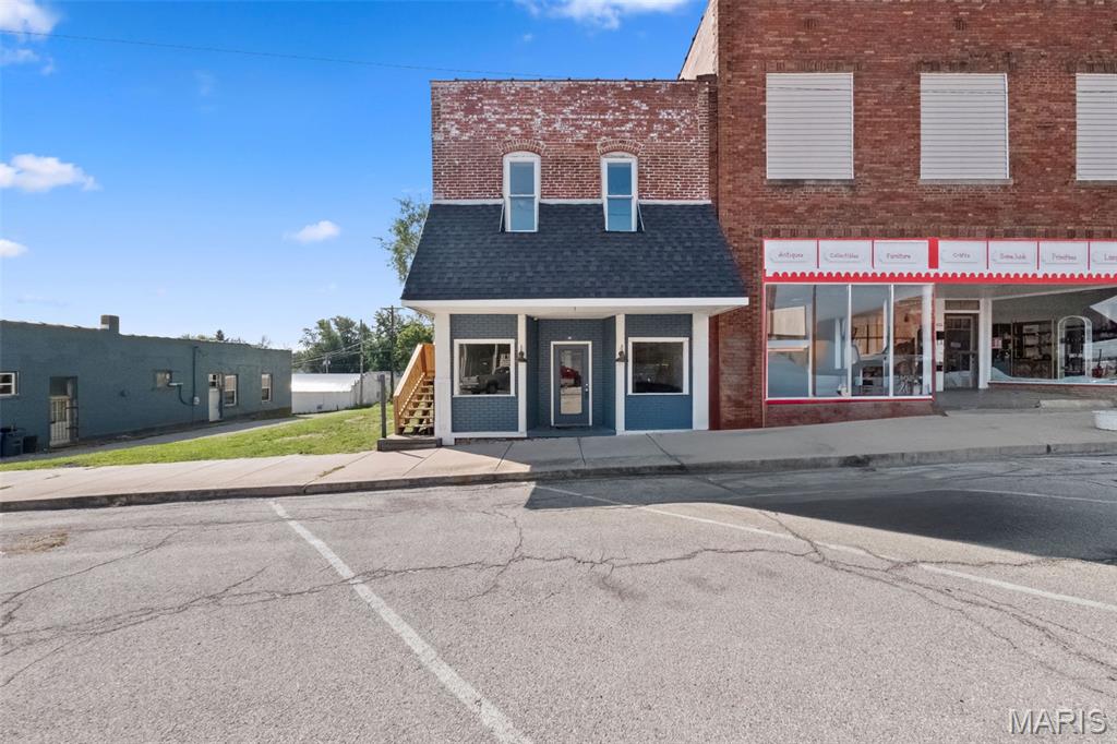 Unlock an exceptional investment opportunity with this versatile building! Located on Broadway, it boasts a prominent storefront and offers about 1000 sq ft of office space on the main level, plus a spacious 1 (potentially 2 bedroom) bedroom, 1-bath apartment on the upper level.
This property has undergone significant upgrades, including  new flooring, fresh paint, and lighting on the main level. A new wall A/C and heating unit ensure comfort year-round, and a renovated bathroom. The store front was previously utilized as a boutique store, the main level is ideal for various business ventures.
The apartment has been updated in the last two years with brand-new kitchen cabinets, countertops, and appliances. For added comfort, two mini-splits have been installed for efficient heating and cooling. Recent improvements, including new electrical work, windows, and doors, round out this fantastic opportunity, making it a must-see for savvy investors!
***The Vacant Lot beside this building is NOT part of the sale***