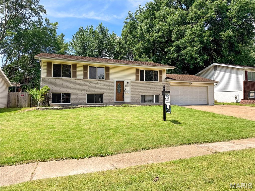 Welcome home to this spacious 4-bedroom, 2-bath split-foyer offering plenty of room to spread out, entertain, and make it your own! Priced at $200,000, this home reflects an excellent opportunity for buyers looking to build equity with a little cosmetic refinement while enjoying numerous major updates already completed.

The updated kitchen features newer cabinetry, countertops, flooring, and appliances, while the home also offers a 200-amp electrical service, high-efficiency furnace, central air, and an updated lower-level bath. The finished lower level provides additional living space with a large family/rec room, fourth bedroom, full bath, and abundant storage.

Outside, you'll find a covered deck overlooking the fenced backyard, an oversized 2-car garage with workshop/storage space, plus additional off-street parking. Conveniently located in Florissant with easy access to shopping, restaurants, parks, and major highways, this home offers tremendous value for buyers ready to add their own finishing touches.

All kitchen appliances stay. Property is being sold in its current condition. Buyer to verify all MLS information, measurements, schools, and taxes.