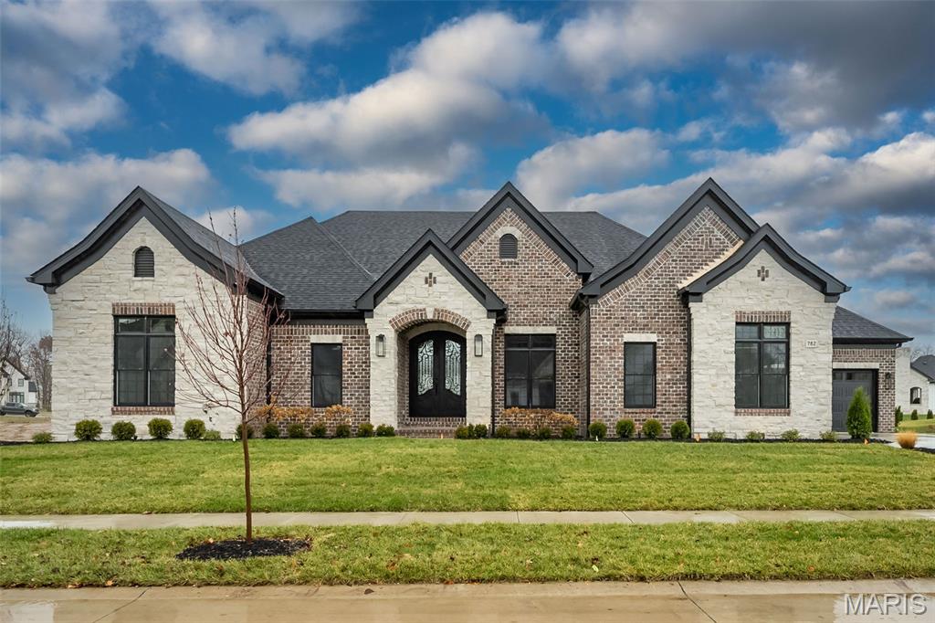 New Construction, Chesterfield, Rockwood Schools! Built by one of St. Louis' premier hands on builders Claymont Development, LLC - Wesley Byrne. The EXCEPTIONAL “ENCLAVE” ranch is a 3 bed, 3.5 bath home of approximately 4,500 sq ft w/ 4 car courtyard garage. Hand forged wrought iron entry door leads to the foyer w/ 12’ ceiling; flanked by formal dining room & office/den. Great room features 12’ ceiling, wall of windows & fireplace paired w/ cabinetry & bookcases. Vaulted hearth room w/ floor to ceiling Masonry fireplace open to the gourmet kitchen w/ HUGE island, all SS appliances, & gorgeous custom cabinetry. Coffered ceiling in Owner’s Suite. Unique brick & stone covered patio. Partially finished walk-out LL includes spacious rec room, custom brick & stone wet bar, 3rd bed & bath. Amenities include: onsite pickle-ball court, walking trail, common ground, & gazebo, perfect for hosting events & socializing w/ neighbors. Tour is of the Display Home