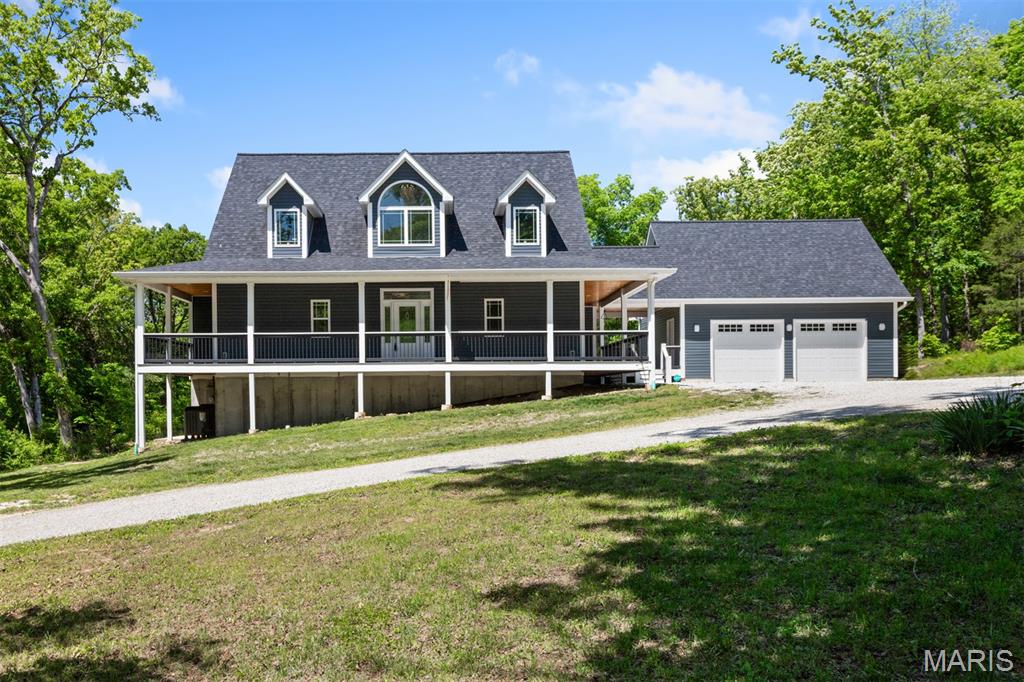 Nestled on 20+ private acres, this luxury home blends timeless craftmanship with modern sophistication. A wrap-around covered porch is perfect for soaking in all the surrounding nature and wildlife. A foyer leads to spacious living areas with dramatic views in every direction. The living room boasts a vaulted ceiling, gas fireplace, built-in media nook and tons of natural light from the large windows with views of the backyard. Gather in the chef’s kitchen complete with gorgeous custom white cabinets, granite countertops, tiled backsplash, stainless steel appliances, center island with breakfast bar & additional seating and a walk-in pantry. Conveniently located right off the kitchen is a huge main floor laundry room. The large master bedroom suite offers a tray ceiling with built-in lighting, large walk-in closet and access to the back deck. The master bathroom has a double sink vanity with tons of storage space, relax in the claw foot soaking tub and admire the oversize walk-in shower. Upstairs you will find 2 nicely sized bedrooms and an additional full-size bathroom. The walk-out basement has been finished with perfection with multiple entertaining spaces at every turn including a family room, recreational area and even a personal home gym room. Also on this lower level is an additional bedroom and full-size bathroom with a step-in shower. Outside the acreage offers endless opportunities with a huge back deck perfect for entertaining and do not forget to check out the amazing in ground saltwater pool with surrounding concrete extending your entertainment abilities and personal recreation with this private setting. This home has an attached 2 car garage as well as a large, detached workshop. Whether you dream of hobby farming, equestrian pursuits, or simply room to breathe, this property offers the freedom to live life at your own pace. Do not hesitate to make your appointment today to come check out this luxury home!