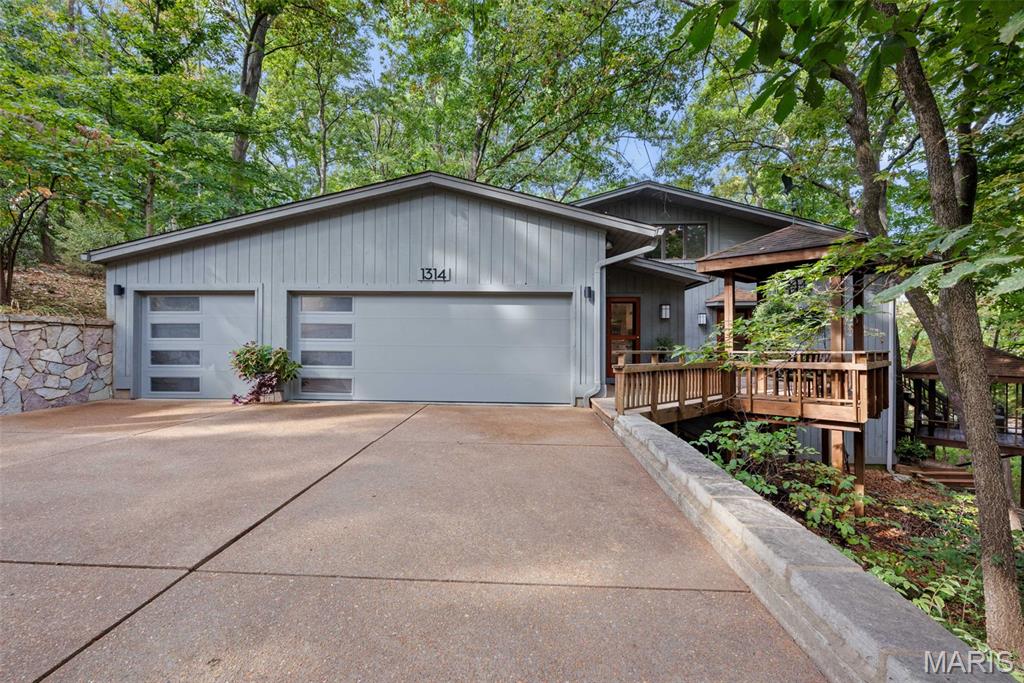 Set in sought-after Sugar Creek, where Kirkwood convenience meets a private, tree-lined setting, this home rests on 1.5 acres above a serene creek, just minutes to downtown Kirkwood and Kirkwood Park. This level of privacy so close to everything is exceptionally rare in the area. Inside, a calm main-floor primary suite with a beautifully updated bath anchors the 3-bed layout. The chef’s kitchen with high-end appliances, double dishwashers, and generous prep space opens to the dining and family rooms, each with a gas fireplace. A main-level half bath keeps entertaining easy. Upstairs offers two bedrooms, a full bath, and a versatile loft/TV room. The finished lower level adds flexible living space, storage, and an additional half bath. A three-car garage with updated doors and ample driveway parking add everyday convenience. Deck to be conveyed AS-IS, offering a great opportunity to create your ideal outdoor retreat. Kirkwood Occupancy Inspection has been completed. Showings begin Fri 9/26 at 10:00 AM. Can't wait for you to see this Kirkwood gem!