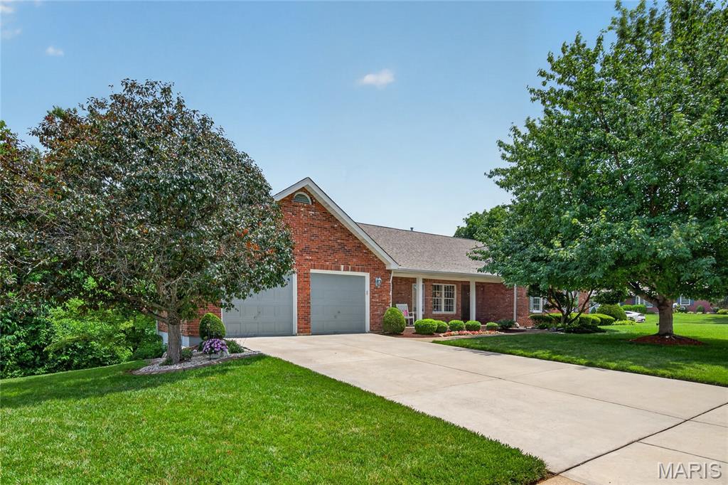 Prepare to be WOWED!  This incredible ranch checks all the boxes when it comes to location, quality, design, curb appeal and more.  This one owner home has been impeccably maintained and beautifully cared or and it shows.  The exterior is captivating with a full brick front, enclosed fascia/soffits, pristine landscaping, architectural shingles, exposed aggregate walkway and porch, brick threshold and leaded glass front door and sidelights.  Features include 3 bedrooms (plus Offices upstairs and downstairs), 3.5 bathrooms, approx 3.762 sq ft of finished living space, a huge Great Room with vaulted ceilings and wood beams, gas fireplace with brick to ceiling, wet bar, atrium doors flanking the fireplace, a spacious Dining Room with bay window, crown molding and cased openings, an Office with double door entry and built in bookcases.  The Kitchen is elegant with granite countertops, glazed cabinets with crown molding, tile backsplash, island with seating bar, downdraft cooktop, double wall ovens, trash compactor, dishwasher, microwave, fridge, recessed lighting and a breakfast room with built in seating, custom shutters and a door to the deck.  The secondary bedrooms are large and have 2 closets and the secondary bathroom on the main floor is updated (2024).  The Primary Bedroom is spacious and has a bay window with window seat that spans the room.  The Primary Bath has raised height double bowl vanities, a jetted soaking tub, separate shower, semi frameless shower doors, vaulted ceiling and a walk-in closet.  The finished lower level is amazing with a huge Family/Rec Room, fireplace with brick to ceiling, custom wet bar, full bathroom, Flex Room/Office, cedar closet and walks out to a covered patio and steps to the deck above.  Added features include Hi-Efficiency HVAC (2024), 50 gallon water heater, Andersen windows, a large deck, an oversized garage (23.3D x 25.7W), 8 ft tall garage doors, finished garage and a lot backing to trees.  A must-see home with so much to love!