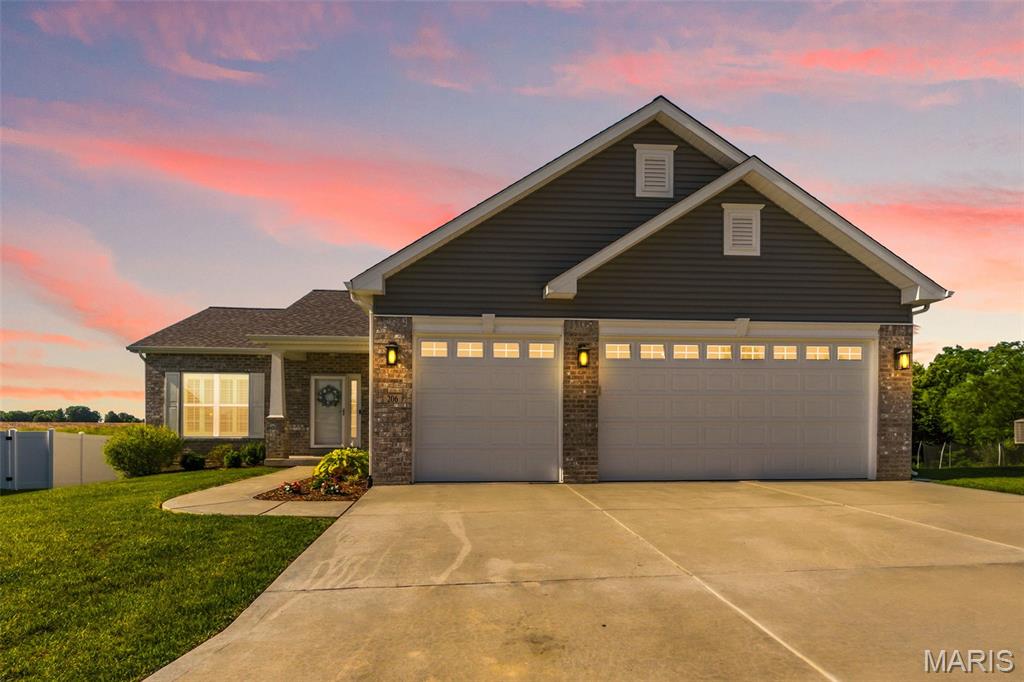 Welcome home to this beautifully maintained 3-bedroom, 2-bath ranch nestled on a quiet cul-de-sac in O'Fallon! Designed with today's lifestyle in mind, the open-concept floor plan offers seamless flow between the living room, kitchen, and breakfast area, all enhanced by soaring 9' ceilings, wood LVP flooring, neutral paint colors, recessed lighting, and abundant transom windows that fill the home with natural light.
The stunning kitchen is the heart of the home, featuring granite countertops, a center island with breakfast bar, farmhouse sink, subway tile backsplash, soft-close cabinetry, walk-in pantry, and slate gray appliances, including a 5-burner gas range and refrigerator that stays. The adjoining breakfast room has a sliding glass door to a low-maintenance composite deck and adjoining patio, creating the perfect space for outdoor dining, entertaining, or simply relaxing while overlooking the fully fenced, level backyard.
Retreat to the spacious primary suite featuring a luxurious en suite bath with dual sinks, separate soaking tub and shower, and an impressive 9' x 6' walk-in closet. The desirable divided-bedroom floor plan provides privacy, with two additional bedrooms and a full bath located on the opposite side of the home. A convenient main-floor laundry room adds everyday ease.
The unfinished lower level offers endless possibilities for future living space and includes an egress window. Car enthusiasts and hobbyists will appreciate the oversized 3-car garage with 8' insulated doors AND a 4-foot extension for extra storage or workspace.
Located in the sought-after Ft. Zumwalt North School district, this home is part of a community featuring stocked fishing ponds, playgrounds, pavilion, and more. With its modern finishes, functional layout, and fantastic neighborhood amenities, this home is one you won't want to miss!