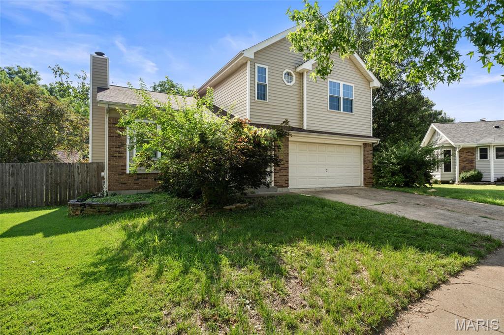 Situated on a cul-de-sac in the heart of Ballwin, this 3-bedroom, 3.5-bath home offers over 2,000 square feet of living space, a finished lower level, and an updated kitchen all in a community known for its charm, convenience, and sense of home. The vaulted living room creates an open and inviting atmosphere filled with natural light and centered around a cozy wood-burning fireplace. The updated kitchen features modern finishes, generous cabinet space, and a functional layout that flows seamlessly into the breakfast and dining area. Upstairs, the expansive primary suite offers a private retreat complete with a custom walk-in closet system designed for maximum organization and storage, along with an ensuite bath. Two large additional bedrooms and a full bathroom provide plenty of space for family, guests, or a home office. The finished lower level expands your living space with a large recreation area, full bathroom, and flexible space perfect for entertaining, working from home, or a media room. Step outside to enjoy the oversized deck overlooking the backyard, complete with a storage shed and plenty of room for outdoor activities. A finished basement, updated kitchen, and desirable cul-de-sac location make this home a standout opportunity in the heart of Ballwin, close to parks, shopping, dining, and top-rated schools.
