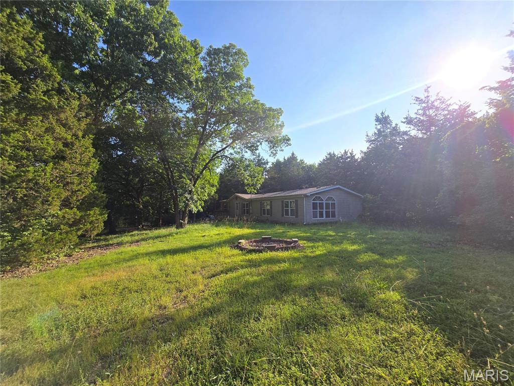 Renters have moved out and the seller prefers to sell instead of replacing carpet, painting and fixing drywall.  This is the chance you've have been waiting for! BUILD INSTANT EQUITY! Opportunity is knocking in Lake Timberline! Less than a mile from the lake, your spacious 1,800+ sq ft home is situated on approx .6 acres with a fenced in back yard, in a gated lake community and is ready for all of those Pinterest ideas you have been saving - giving you the opportunity to make this home your very own and presenting a rare chance to purchase well below the cost of many comparable homes in the area! This home offers tremendous potential for a buyer looking to add their own personal touches and build equity! Land, generous living space and a desirable community make Walnut Lane a rare find at this price point! The property is being sold as-is. Some personal items will remain with the home after closing. Opportunities to purchase a home of this size and location at this price are increasingly rare - do not miss your chance to make it your very own! Bring your vision, customize to your taste and unlock the full potential of this amazing home before it's too late!