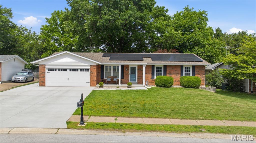 Seldom do you find a home that has so much to offer.  From the time you walk in, you will be amazed?  Home has been updated throughout and offers a cozy family room with a wood burning fireplace.  For more formal occasions there is a separate livingroom.  Kitchen offers plenty of work space and lots of storage with the 42 inch cabinetry.  The stylish back splash will certainly please you as well.  Lower level offers a large rec area and a separate room that could be your home office, exercise room or just an additional sleeping space.  Here you will also find a 3rd full bathroom. Let's head back upstairs and step out to the large screened in porch.  No worries about mosquitoes or rain here to ruin you relaxing outside.  This all brick home will provide you with very little maintenance.  Parking is no problem with the large extended driveway.  Need additional storage, there is also storage shed.  If you are tired of high energy bills, the solar panels will help reduce them!!  Home show pride of ownership by the seller.  Showings begin on Saturday May 30th.