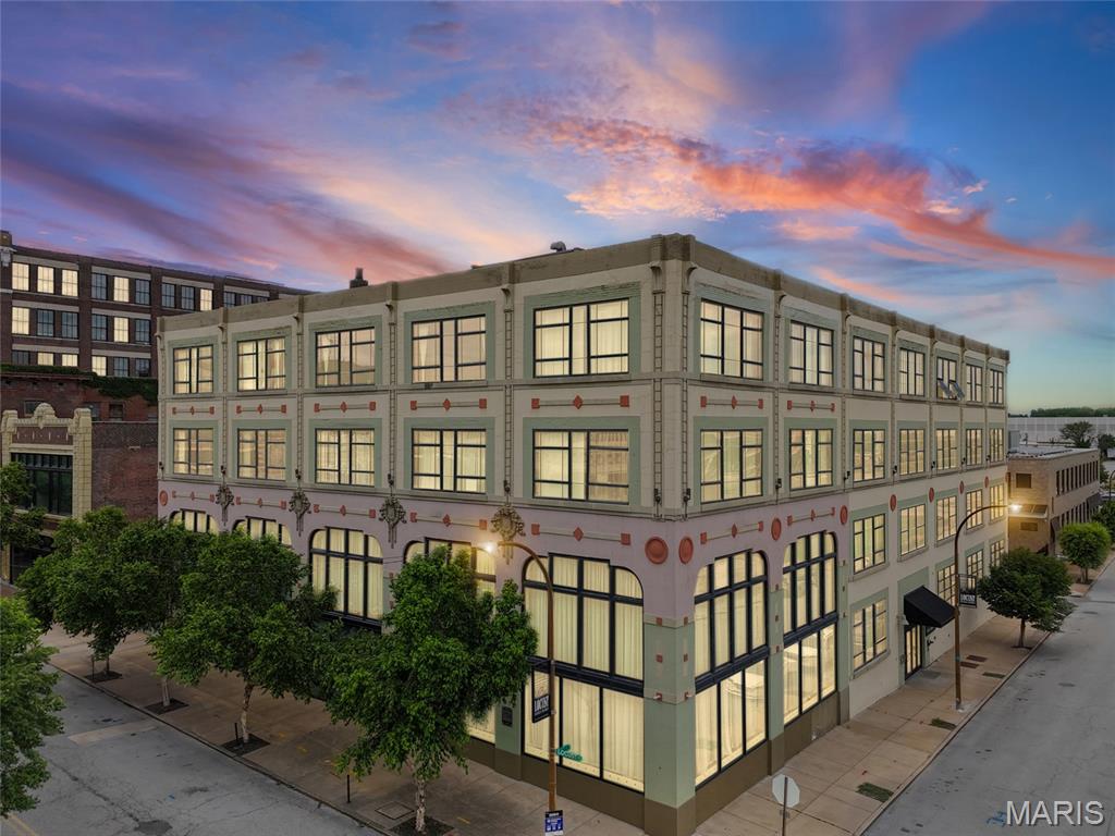 Welcome to Packard Lofts, where historic character meets modern downtown living. Unit 410 offers 1,240 square feet of authentic urban loft living in one of downtown St. Louis’ most iconic buildings. This spacious residence features soaring ceilings, exposed brick walls, polished concrete floors, and oversized warehouse-style windows that fill the home with natural light and showcase dynamic city views. The open-concept layout includes two bedrooms, two full bathrooms, and a well-designed kitchen that flows seamlessly into the living and dining areas—ideal for both entertaining and everyday living with the stadium views from your living room! Located in the dynamic West Downtown St. Louis area, steps away from St. Louis CITY soccer stadium and within minutes of Union Station, Busch Stadium, Enterprise Center, and downtown’s best dining and entertainment, this location offers exceptional walkability and access to the city’s continued growth and redevelopment. Additional features include secure building access, assigned garage parking (PG-17), in-unit laundry, and the timeless industrial charm of historic Art Deco architecture.
