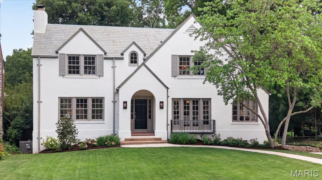 Welcome to 7117 Maryland, a stunning 1926 French Tudor of classic proportions completely renovated and reimagined to perfection. Built in 1926 in the tree lined Maryland Terrance neighborhood of University City, this home is within walking distance to Clayton, Washington University and Forest Park, and represents the very best of St. Louis living. From the moment you step in the front door the carefully curated details abound. The spacious and light filled  living room is anchored by original built-ins, a wood burning fireplace and 2 doors that open to a new deck, perfect for entertaining family and friends. The custom chef's kitchen has a large island, Kitchen Aid range and refrigerator and opens to a light and charm filled casual dining area and mudroom. The spacious dining room has original french and bi fold glass doors and you'll also find a sun filled family room with round topped casement windows on the first floor. Upstairs there is a lovely primary suite with a sitting area, a full bath and a walk-in closet. Down the hall you'll find two additional bedrooms and a second full bath plus a convenient laundry space. The walk-out basement has been refined and is ready for future expansion, and the home has new windows and systems throughout. Outside, the magic continues with a lovely large original brick patio and spacious private, partially fenced yard that could easily be imagined into an even more spectacular extension of this property. 7117 Maryland is a fabulous home, beautifully reimagined and renovated in keeping with its original form and style, but with all the amenities to make it an exceptionally comfortable place to live.