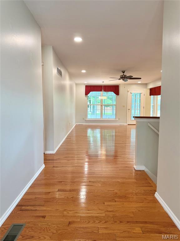 Welcome to a rare and exceptional opportunity to own a detached villa featuring four bedrooms on the main level, a truly hard-to-find layout.  Step inside to discover a bright, open floor plan enhanced by beautifully updated hardwood flooring in the great room and dining area, and comfortable carpeting in the bedrooms. The spacious great room flows seamlessly into the dining area and an updated kitchen, offering abundant cabinetry and storage, perfect for everyday living and entertaining.  Enjoy the convenience of main-floor living, including a laundry room and a generously sized primary suite featuring brand new carpeting. a walk-in closet and a full bath with a soaking tub, separate shower, and double vanity. Three additional main-level bedrooms provide flexibility for family, guests, or a home office.  Relax and unwind in the three-season room, ideal for enjoying peaceful mornings or evening gatherings.
Additional highlights include a two-car attached garage with a new garage door opener with a battery backup, and a full, unfinished lower level offering incredible potential for expansion, with ample space and a rough-in for a future bathroom.  This beautiful home offers carefree living, with lawn care and snow removal included in the low monthly fee of just $232.  Conveniently located near Highways 270 and 55, you’ll enjoy easy access to shopping, dining, and commuting routes.