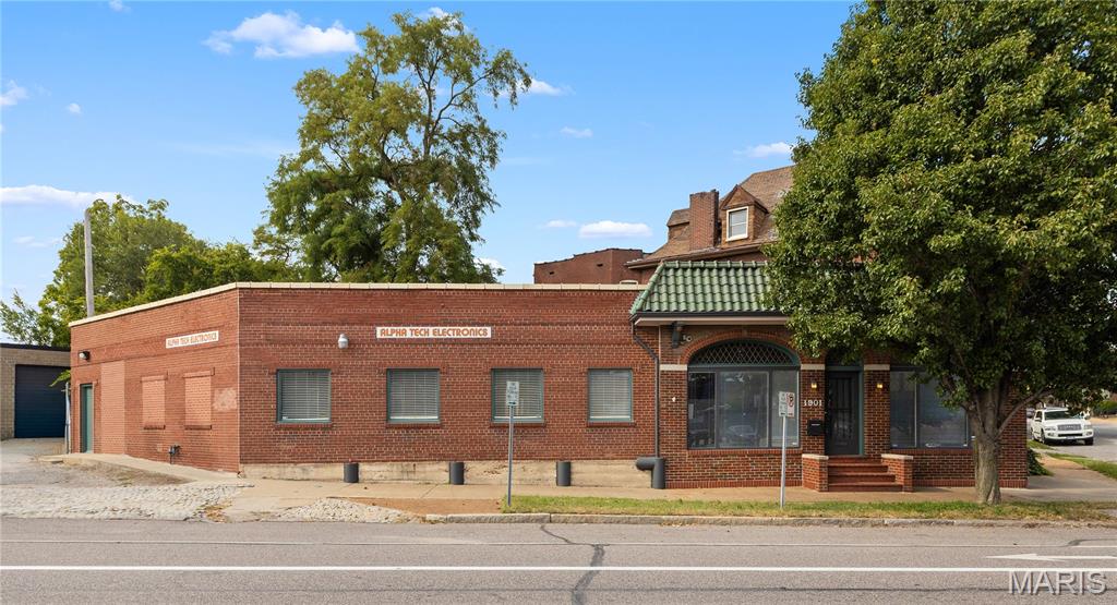 Start or expand your dreams in this high visibility corner storefront.  Convenient location just off 55/44/40/70 interchanges.  Historic building with premium front office space and lots of customizable sq footage.  Almost 4000 sq ft of opportunity to build your business to the next level.  Offstreet gated parking.  Front foyer is special with a restored tin ceiling - big windows - new lighting - premium flooring.  Foyer opens to a large showroom. 3 half baths and 3 office spaces.  Zoned heating and cooling.  Blocks from Lafayette Square this office/warehouse/flex space is sure to excite and open doors for a bright future.