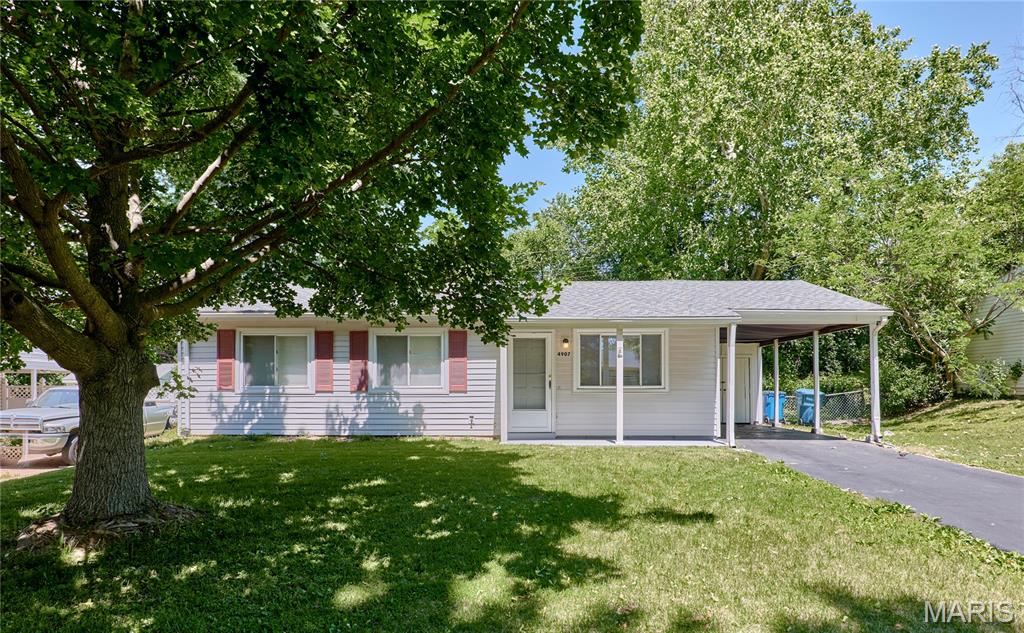 Welcome home to this adorable, move-in ready ranch with tons of amazing updates and features! This home boasts beautiful LVP flooring throughout, updated kitchen and bathrooms, private fenced backyard, covered carport with storage, and more! Enter into the light & bright living room with beautiful LVP flooring and large front window. You’ll love the updated kitchen featuring modern, soft-close cabinetry, quartz countertops, and a newer refrigerator and stove. Just off the kitchen is the convenient, main floor laundry room that adds everyday functionality with easy access to the spacious backyard and patio perfect to enjoy your morning coffee! The primary bedroom offers LVP flooring and a private, updated half bathroom. Two additional bedrooms and an updated full hall bathroom complete the home. Situated in the Hazelwood School District just minutes from beautiful parks, Saint Stanislaus conservation area, community centers, shopping, restaurants, and more. Come see this charming ranch home today!